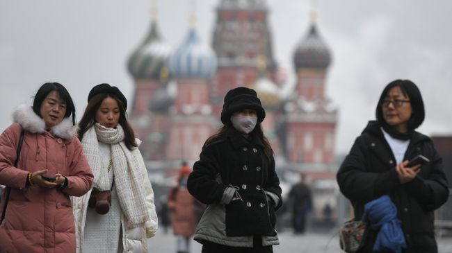 Туристы на Красной площади в Москве Туристы на Красной площади в Москве