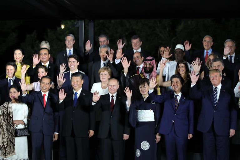 Президент РФ Владимир Путин на церемонии совместного фотографирования глав делегаций государств – участников саммита Группы двадцати. 28 июня 2019 