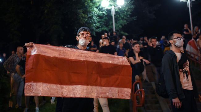 Участники акции протеста на одной из улиц в Минске Участники акции протеста на одной из улиц в Минске