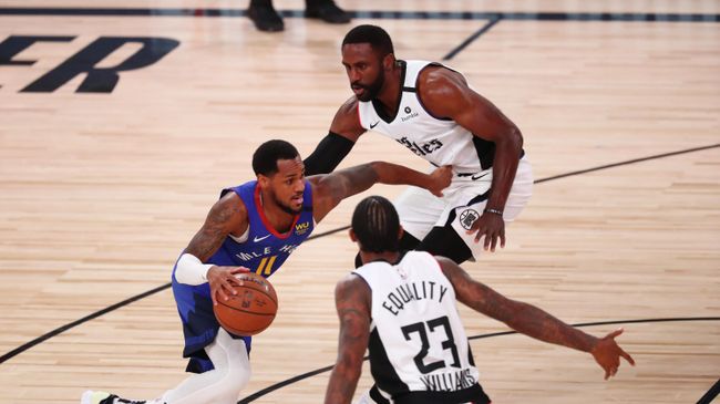 LAKE BUENA VISTA, FLORIDA - AUGUST 12: Monte Morris #11 of the Denver Nuggets drives between Patrick Patterson #54 and Lou Williams #23 of the LA Clippers in the fourth quarter at AdventHealth Arena at ESPN Wide World Of Sports Complex on August 12, 2020 in Lake Buena Vista, Florida. NOTE TO USER: User expressly acknowledges and agrees that, by downloading and or using this photograph, User is consenting to the terms and conditions of the Getty Images License Agreement. Kim Klement-Pool/Getty Images/AFP LAKE BUENA VISTA, FLORIDA - AUGUST 12: Monte Morris #11 of the Denver Nuggets drives between Patrick Patterson #54 and Lou Williams #23 of the LA Clippers in the fourth quarter at AdventHealth Arena at ESPN Wide World Of Sports Complex on August 12, 2020 in Lake Buena Vista, Florida. NOTE TO USER: User expressly acknowledges and agrees that, by downloading and or using this photograph, User is consenting to the terms and conditions of the Getty Images License Agreement. Kim Klement-Pool/Getty Images/AFP