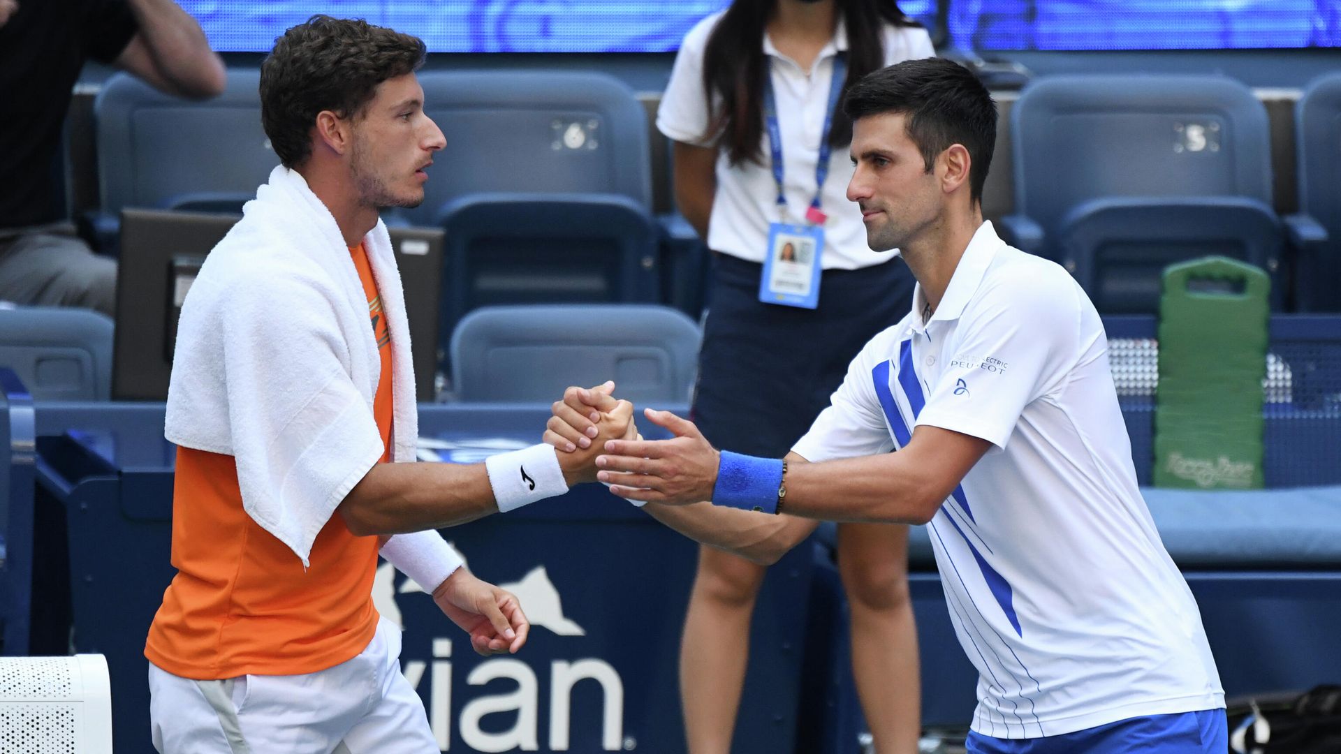 Sep 6, 2020; Flushing Meadows, New York, USA; Novak Djokovic of Serbia shakes hands with Pablo Carreno Busta of Spain after being defaulted for striking a lines person with a ball on day seven of the 2020 U.S. Open tennis tournament at USTA Billie Jean King National Tennis Center. Mandatory Credit: Danielle Parhizkaran-USA TODAY Sports Sep 6, 2020; Flushing Meadows, New York, USA; Novak Djokovic of Serbia shakes hands with Pablo Carreno Busta of Spain after being defaulted for striking a lines person with a ball on day seven of the 2020 U.S. Open tennis tournament at USTA Billie Jean King National Tennis Center. Mandatory Credit: Danielle Parhizkaran-USA TODAY Sports - РИА Новости, 1920, 07.09.2020