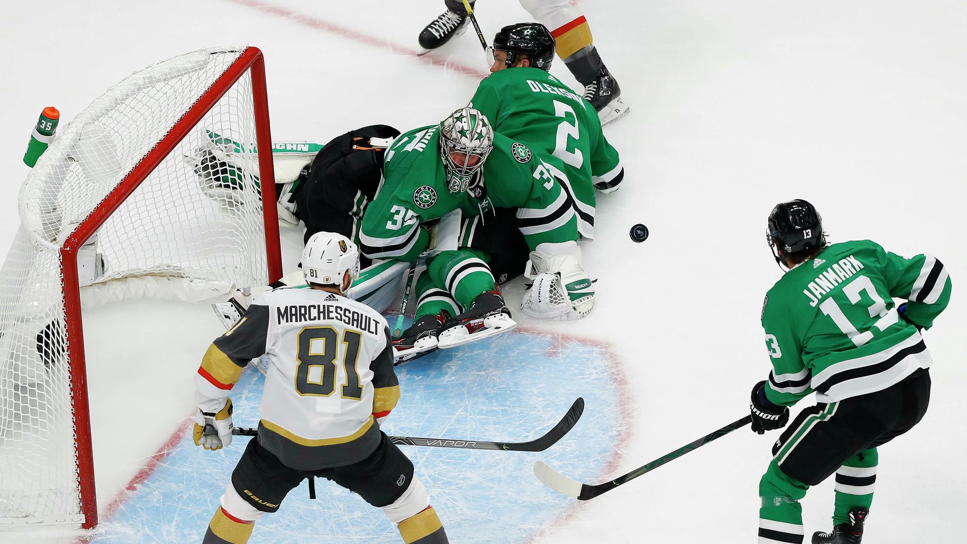 September 12, 2020; Edmonton, Alberta, CAN; Dallas Stars goaltender Anton Khudobin (35) defends the goal as center Mattias Janmark (13) provides coverage against Vegas Golden Knights center Jonathan Marchessault (81) during the second period in game four of the Western Conference Final of the 2020 Stanley Cup Playoffs at Rogers Place. Mandatory Credit: Perry Nelson-USA TODAY Sports September 12, 2020; Edmonton, Alberta, CAN; Dallas Stars goaltender Anton Khudobin (35) defends the goal as center Mattias Janmark (13) provides coverage against Vegas Golden Knights center Jonathan Marchessault (81) during the second period in game four of the Western Conference Final of the 2020 Stanley Cup Playoffs at Rogers Place. Mandatory Credit: Perry Nelson-USA TODAY Sports - РИА Новости, 1920, 13.09.2020