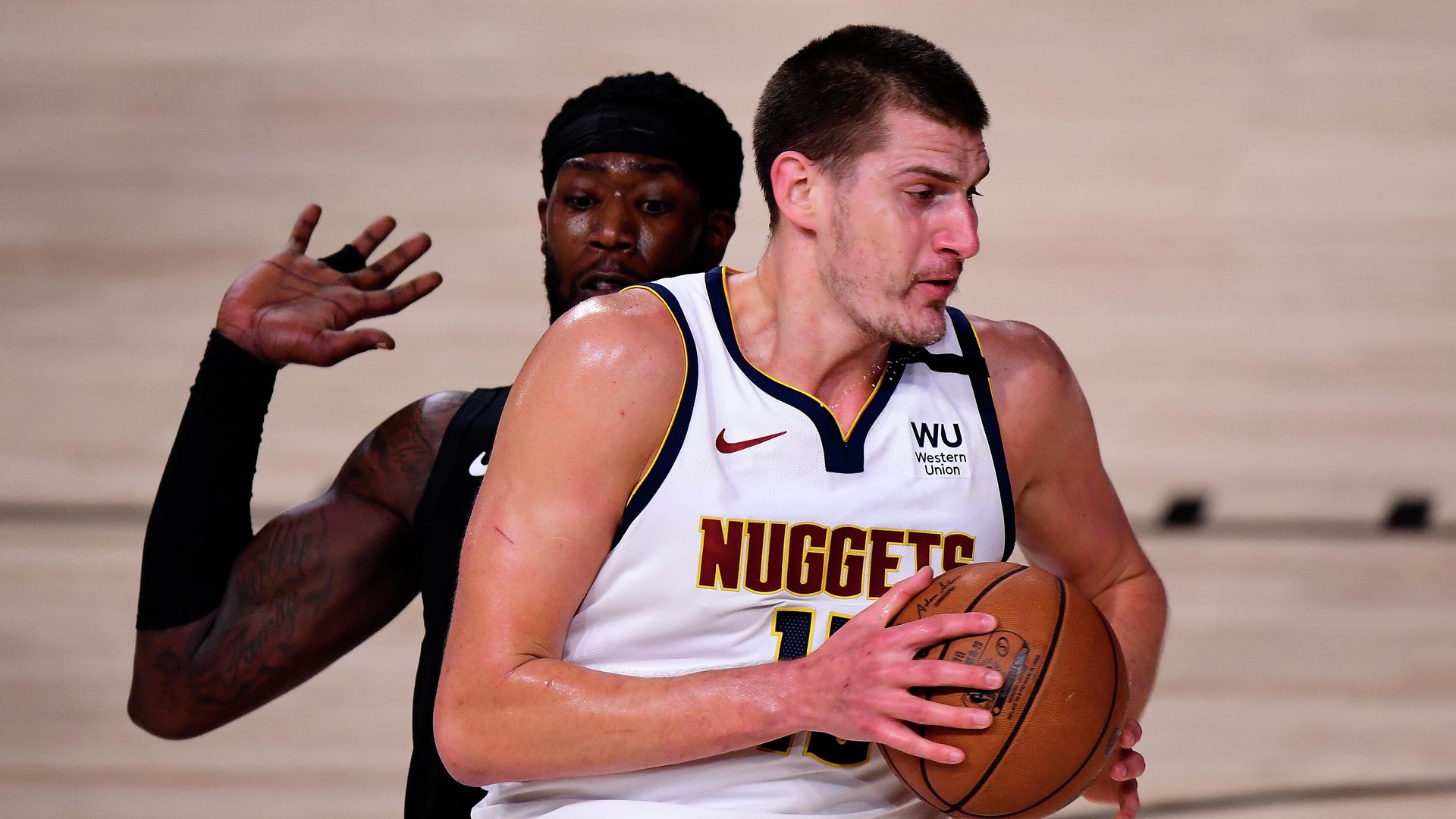 LAKE BUENA VISTA, FLORIDA - SEPTEMBER 15: Nikola Jokic #15 of the Denver Nuggets drives the ball against Montrezl Harrell #5 of the LA Clippers during the first quarter in Game Seven of the Western Conference Second Round during the 2020 NBA Playoffs at AdventHealth Arena at the ESPN Wide World Of Sports Complex on September 15, 2020 in Lake Buena Vista, Florida. NOTE TO USER: User expressly acknowledges and agrees that, by downloading and or using this photograph, User is consenting to the terms and conditions of the Getty Images License Agreement. Douglas P. DeFelice/Getty Images/AFP LAKE BUENA VISTA, FLORIDA - SEPTEMBER 15: Nikola Jokic #15 of the Denver Nuggets drives the ball against Montrezl Harrell #5 of the LA Clippers during the first quarter in Game Seven of the Western Conference Second Round during the 2020 NBA Playoffs at AdventHealth Arena at the ESPN Wide World Of Sports Complex on September 15, 2020 in Lake Buena Vista, Florida. NOTE TO USER: User expressly acknowledges and agrees that, by downloading and or using this photograph, User is consenting to the terms and conditions of the Getty Images License Agreement. Douglas P. DeFelice/Getty Images/AFP - РИА Новости, 1920, 16.09.2020