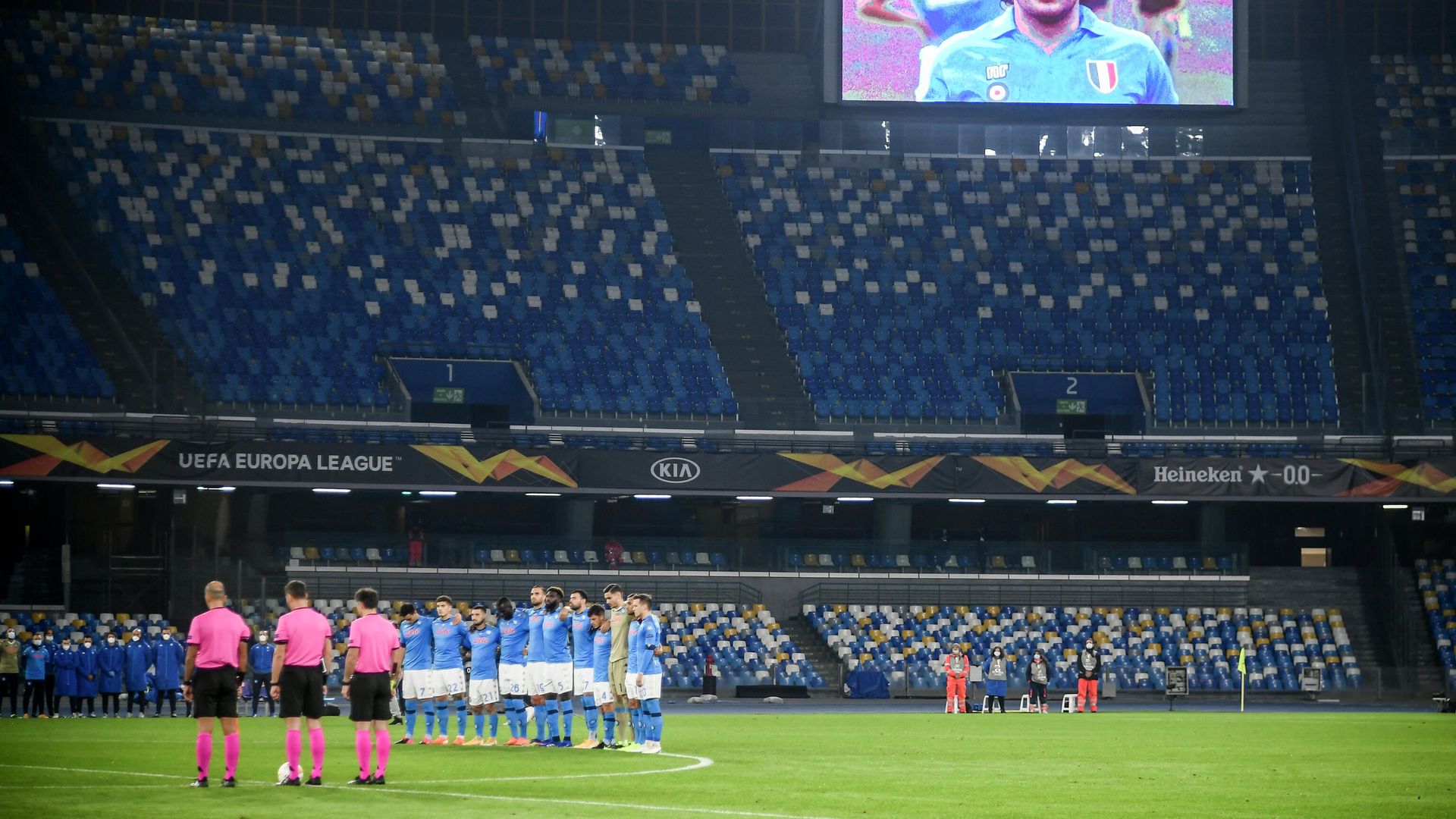 A screen displays a photo of late Argentinian football legend Diego Maradona as players hold a minute of silence in homage to Maradona prior to the UEFA Europe League Group F football match Napoli vs Rijeka on November 26, 2020 at the San Paolo stadium in Naples. - Maradona, widely remembered for his Hand of God goal against England in the 1986 World Cup quarter-finals, died on November 25, 2020 of a heart attack at his home near Buenos Aires in Argentina, while recovering from surgery to remove a blood clot on his brain. (Photo by Filippo MONTEFORTE / AFP) A screen displays a photo of late Argentinian football legend Diego Maradona as players hold a minute of silence in homage to Maradona prior to the UEFA Europe League Group F football match Napoli vs Rijeka on November 26, 2020 at the San Paolo stadium in Naples. - Maradona, widely remembered for his Hand of God goal against England in the 1986 World Cup quarter-finals, died on November 25, 2020 of a heart attack at his home near Buenos Aires in Argentina, while recovering from surgery to remove a blood clot on his brain. (Photo by Filippo MONTEFORTE / AFP) - РИА Новости, 1920, 26.11.2020