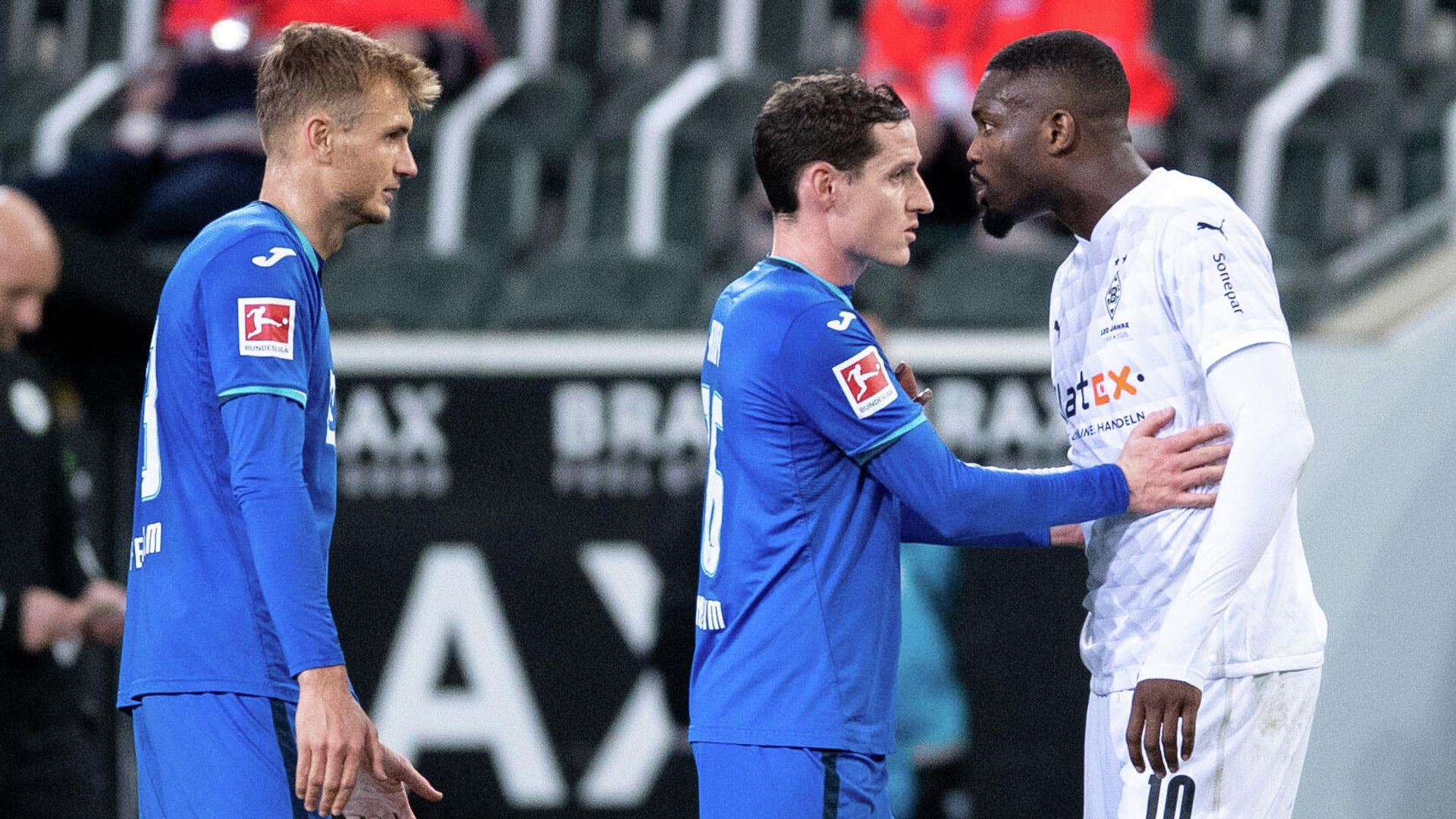 Soccer Football - Bundesliga - Borussia Moenchengladbach v TSG 1899 Hoffenheim - Borussia-Park, Moenchengladbach, Germany - December 19, 2020 Borussia Moenchengladbach's Marcus Thuram and TSG 1899 Hoffenheim's Stefan Posch clash Pool via REUTERS/Marius Becker DFL regulations prohibit any use of photographs as image sequences and/or quasi-video. Soccer Football - Bundesliga - Borussia Moenchengladbach v TSG 1899 Hoffenheim - Borussia-Park, Moenchengladbach, Germany - December 19, 2020 Borussia Moenchengladbach's Marcus Thuram and TSG 1899 Hoffenheim's Stefan Posch clash Pool via REUTERS/Marius Becker DFL regulations prohibit any use of photographs as image sequences and/or quasi-video. - РИА Новости, 1920, 20.12.2020