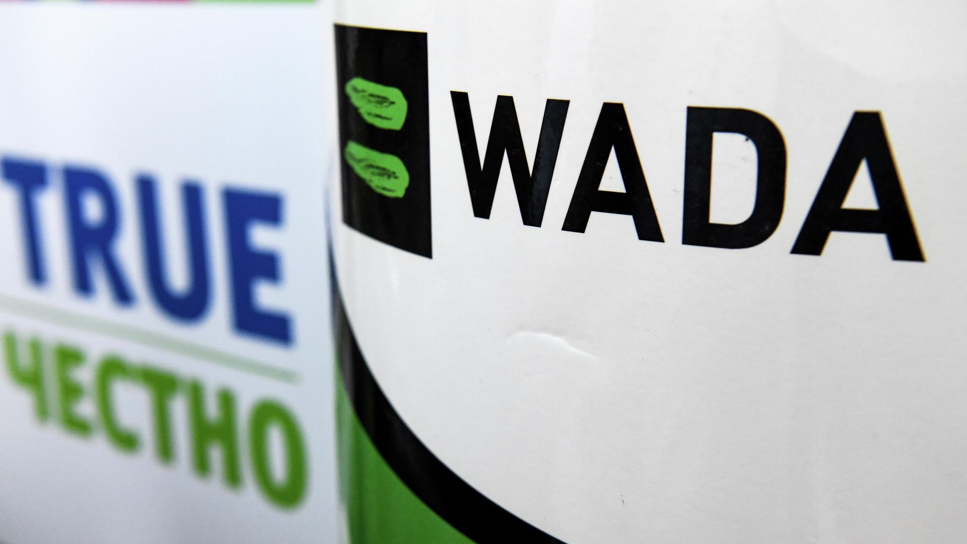The World Anti-Doping Agency or WADA logo is pictured at the Russkaya Zima (Russian Winter) Athletics competition in Moscow on February 9, 2020. - The entire board of Russia's athletics federation has resigned as the government attempts to find a way out of the country's deepening doping crisis before this year's Olympic Games. (Photo by Kirill KUDRYAVTSEV / AFP) - РИА Новости, 1920, 18.02.2021