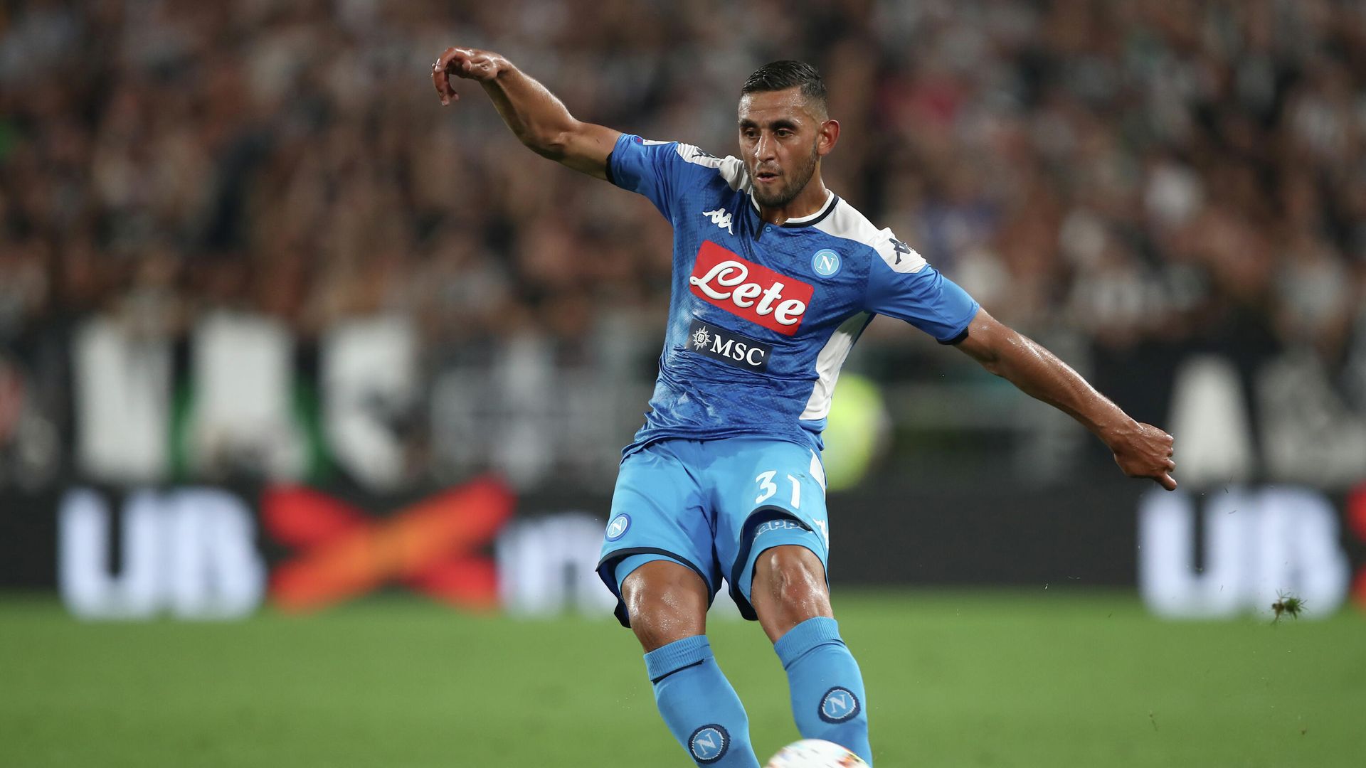 Napoli's Algerian defender Faouzi Ghoulam passes the ball during the Italian Serie A football match Juventus vs Napoli on August 31, 2019 at the Juventus stadium in Turin. (Photo by Isabella Bonotto / AFP) - РИА Новости, 1920, 05.02.2021