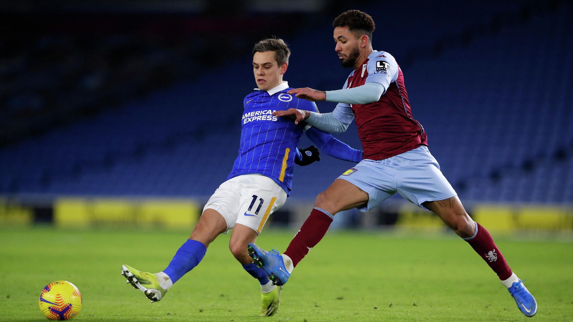 Aston Villa's Brazilian midfielder Douglas Luiz (R) pressures Brighton's Belgian midfielder Leandro Trossard (L) during the English Premier League football match between Brighton and Hove Albion and Aston Villa at the American Express Community Stadium in Brighton, southern England on February 13, 2021. (Photo by ANDREW COULDRIDGE / POOL / AFP) / RESTRICTED TO EDITORIAL USE. No use with unauthorized audio, video, data, fixture lists, club/league logos or 'live' services. Online in-match use limited to 120 images. An additional 40 images may be used in extra time. No video emulation. Social media in-match use limited to 120 images. An additional 40 images may be used in extra time. No use in betting publications, games or single club/league/player publications. / Aston Villa's Brazilian midfielder Douglas Luiz (R) pressures Brighton's Belgian midfielder Leandro Trossard (L) during the English Premier League football match between Brighton and Hove Albion and Aston Villa at the American Express Community Stadium in Brighton, southern England on February 13, 2021. (Photo by ANDREW COULDRIDGE / POOL / AFP) / RESTRICTED TO EDITORIAL USE. No use with unauthorized audio, video, data, fixture lists, club/league logos or 'live' services. Online in-match use limited to 120 images. An additional 40 images may be used in extra time. No video emulation. Social media in-match use limited to 120 images. An additional 40 images may be used in extra time. No use in betting publications, games or single club/league/player publications. / - РИА Новости, 1920, 14.02.2021