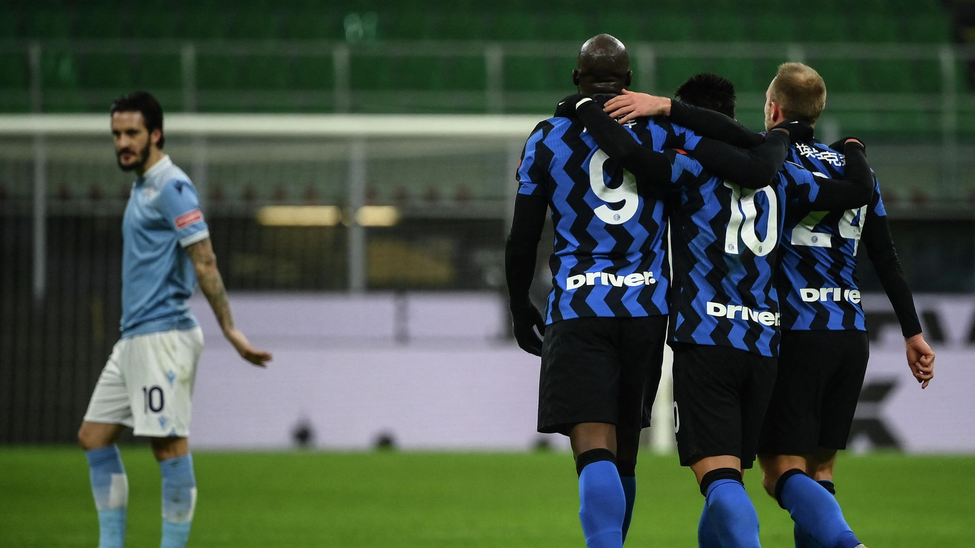 Inter Milan's Belgian forward Romelu Lukaku (C) celebrates with Inter Milan's Argentine forward Lautaro Martinez (2ndR) and Inter Milan's Danish midfielder Christian Eriksen (R) next to Lazio's Spanish midfielder Luis Alberto (L) after scoring his second goal during the Italian Serie A football match Inter Milan vs Lazio Rome on February 14, 2021 at the San Siro stadium in Milan. (Photo by Marco BERTORELLO / AFP) Inter Milan's Belgian forward Romelu Lukaku (C) celebrates with Inter Milan's Argentine forward Lautaro Martinez (2ndR) and Inter Milan's Danish midfielder Christian Eriksen (R) next to Lazio's Spanish midfielder Luis Alberto (L) after scoring his second goal during the Italian Serie A football match Inter Milan vs Lazio Rome on February 14, 2021 at the San Siro stadium in Milan. (Photo by Marco BERTORELLO / AFP) - РИА Новости, 1920, 15.02.2021