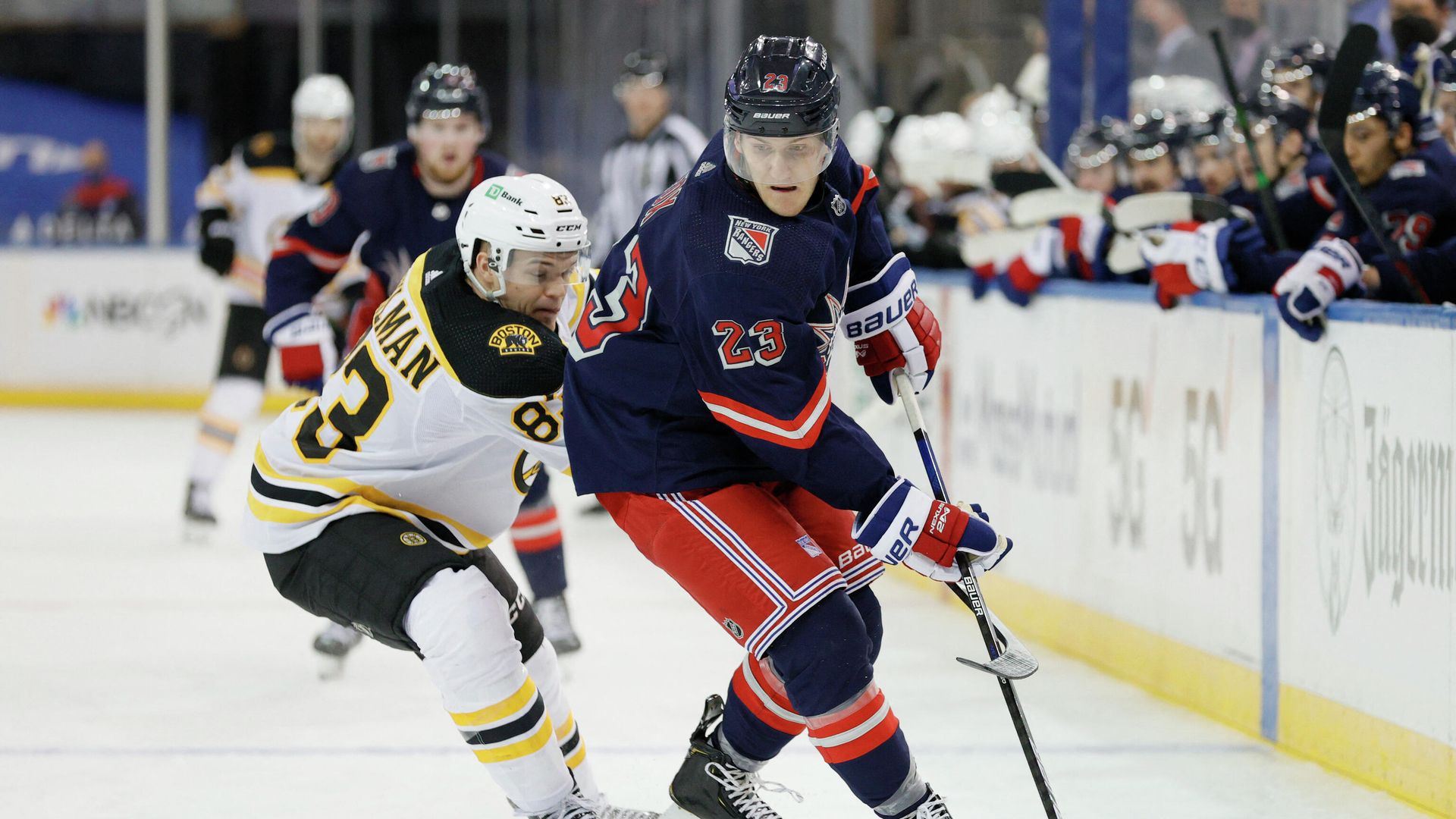 NEW YORK, NEW YORK - FEBRUARY 28: Adam Fox #23 of the New York Rangers controls the puck as Karson Kuhlman #83 of the Boston Bruins defends during the third period at Madison Square Garden on February 28, 2021 in New York City. The Bruins won 4-1. Sarah Stier/Getty Images/AFP (Photo by Sarah Stier / GETTY IMAGES NORTH AMERICA / Getty Images via AFP) NEW YORK, NEW YORK - FEBRUARY 28: Adam Fox #23 of the New York Rangers controls the puck as Karson Kuhlman #83 of the Boston Bruins defends during the third period at Madison Square Garden on February 28, 2021 in New York City. The Bruins won 4-1. Sarah Stier/Getty Images/AFP (Photo by Sarah Stier / GETTY IMAGES NORTH AMERICA / Getty Images via AFP) - РИА Новости, 1920, 28.02.2021