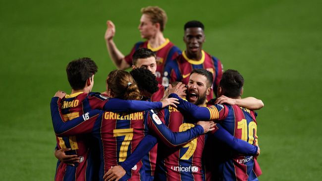Barcelona players celebrate their third goal scored by Barcelona's Danish forward Martin Braithwaite during Spanish Copa del Rey (King's Cup) semi-final second leg football match between FC Barcelona and Sevilla FC at the Camp Nou stadium in Barcelona on March 3, 2021. (Photo by Josep LAGO / AFP)