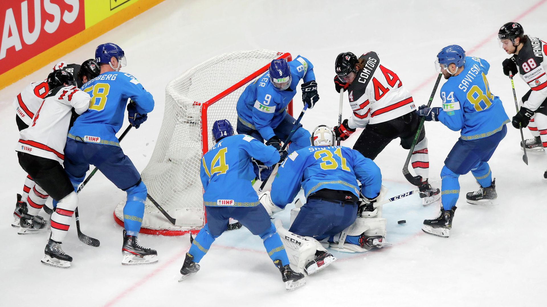 Ice Hockey - IIHF World Ice Hockey Championship 2021 - Group B - Kazakhstan v Canada - Arena Riga, Riga, Latvia - May 28, 2021 Kazakhstan's Andrei Shutov, Jesse Blacker and teammates in action with Canada's Maxime Comtois REUTERS/Vasily Fedosenko Ice Hockey - IIHF World Ice Hockey Championship 2021 - Group B - Kazakhstan v Canada - Arena Riga, Riga, Latvia - May 28, 2021 Kazakhstan's Andrei Shutov, Jesse Blacker and teammates in action with Canada's Maxime Comtois REUTERS/Vasily Fedosenko - РИА Новости, 1920, 28.05.2021