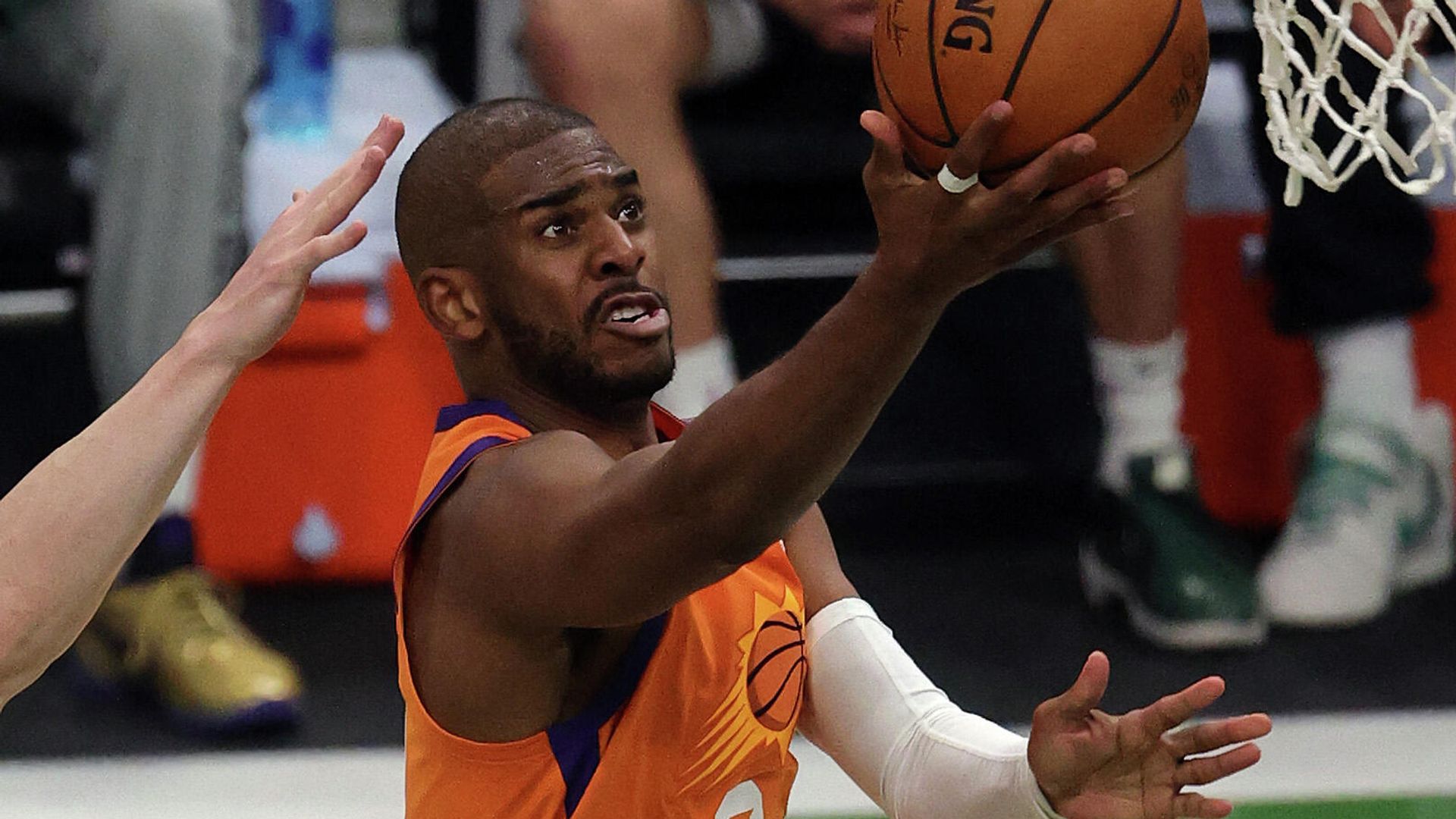 MILWAUKEE, WISCONSIN - JULY 20: Chris Paul #3 of the Phoenix Suns goes up for a shot against the Milwaukee Bucks during the first half in Game Six of the NBA Finals at Fiserv Forum on July 20, 2021 in Milwaukee, Wisconsin. NOTE TO USER: User expressly acknowledges and agrees that, by downloading and or using this photograph, User is consenting to the terms and conditions of the Getty Images License Agreement. Jonathan Daniel/Getty Images/AFP (Photo by JONATHAN DANIEL / GETTY IMAGES NORTH AMERICA / Getty Images via AFP) MILWAUKEE, WISCONSIN - JULY 20: Chris Paul #3 of the Phoenix Suns goes up for a shot against the Milwaukee Bucks during the first half in Game Six of the NBA Finals at Fiserv Forum on July 20, 2021 in Milwaukee, Wisconsin. NOTE TO USER: User expressly acknowledges and agrees that, by downloading and or using this photograph, User is consenting to the terms and conditions of the Getty Images License Agreement. Jonathan Daniel/Getty Images/AFP (Photo by JONATHAN DANIEL / GETTY IMAGES NORTH AMERICA / Getty Images via AFP) - РИА Новости, 1920, 02.08.2021