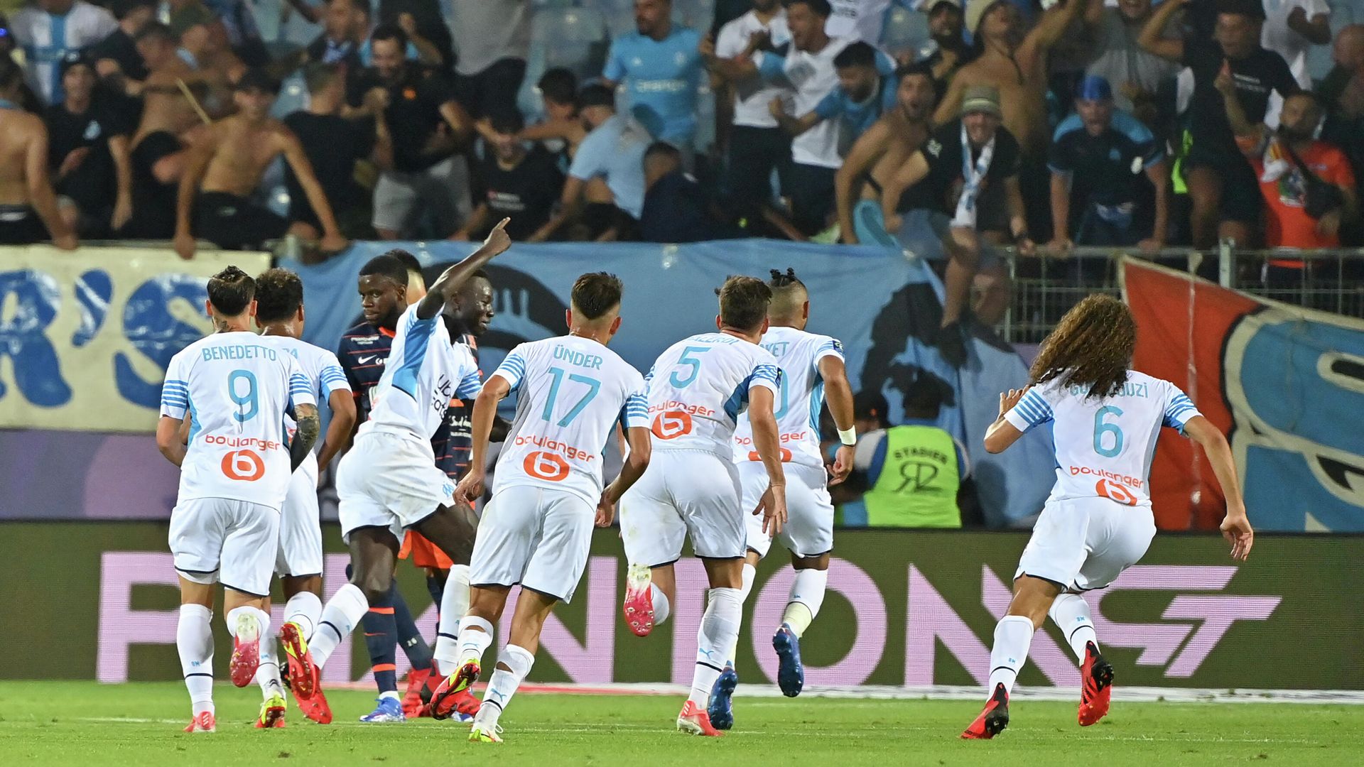 Marseille's players react after scoring a goal during the French L1 football match between Montpellier and Marseille at the Mosson stadium in Montpellier, southern France on August 8, 2021. (Photo by Pascal GUYOT / AFP) Marseille's players react after scoring a goal during the French L1 football match between Montpellier and Marseille at the Mosson stadium in Montpellier, southern France on August 8, 2021. (Photo by Pascal GUYOT / AFP) - РИА Новости, 1920, 09.08.2021