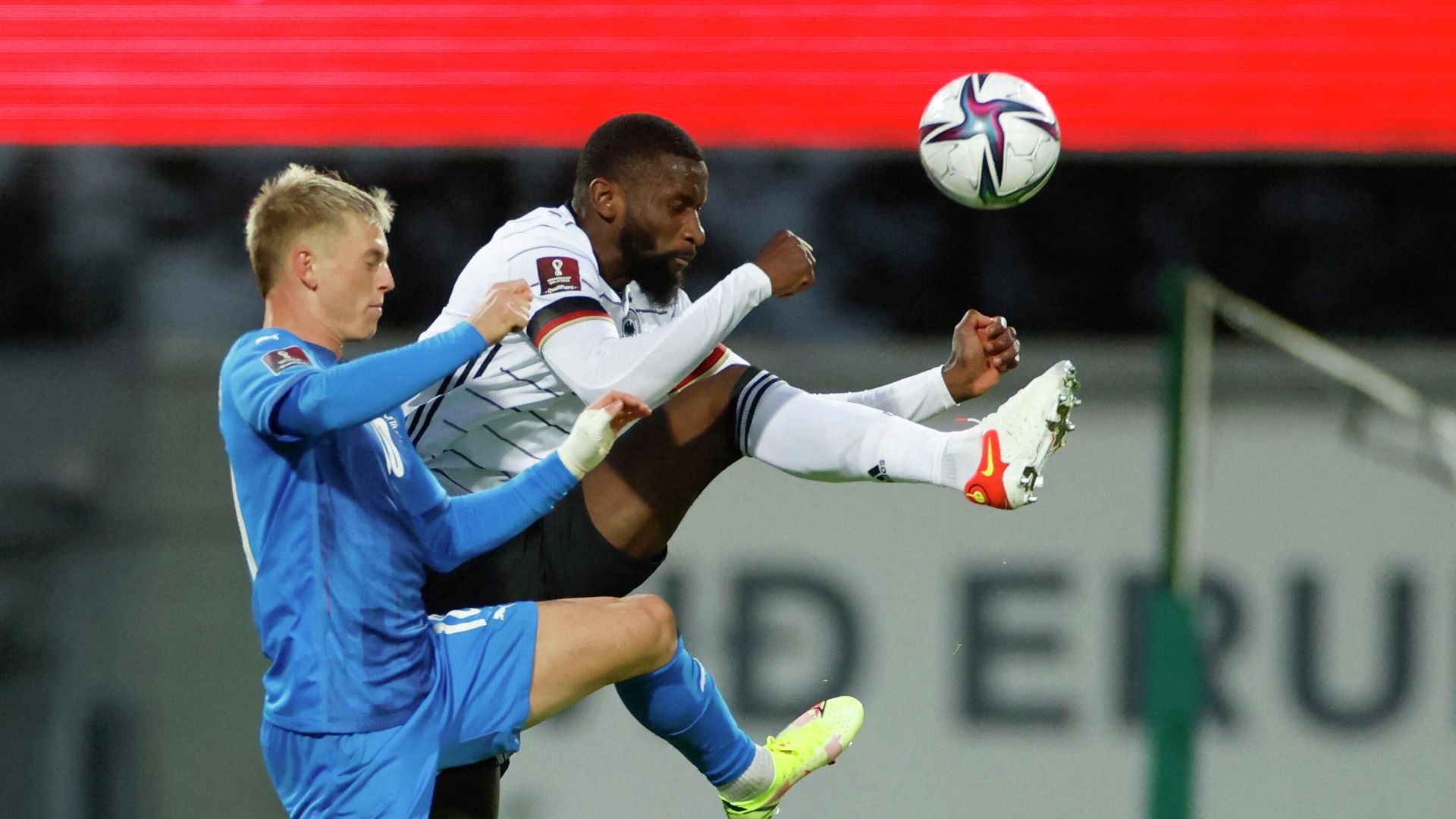 Germany's defender Antonio Ruediger (R) and Iceland's midfielder Albert Gudmundsson vie for the ball during the FIFA World Cup Qatar 2022 qualification Group J football match between Iceland and Germany in Reykjavik, on September 8, 2021. (Photo by Odd ANDERSEN / AFP) - РИА Новости, 1920, 09.09.2021