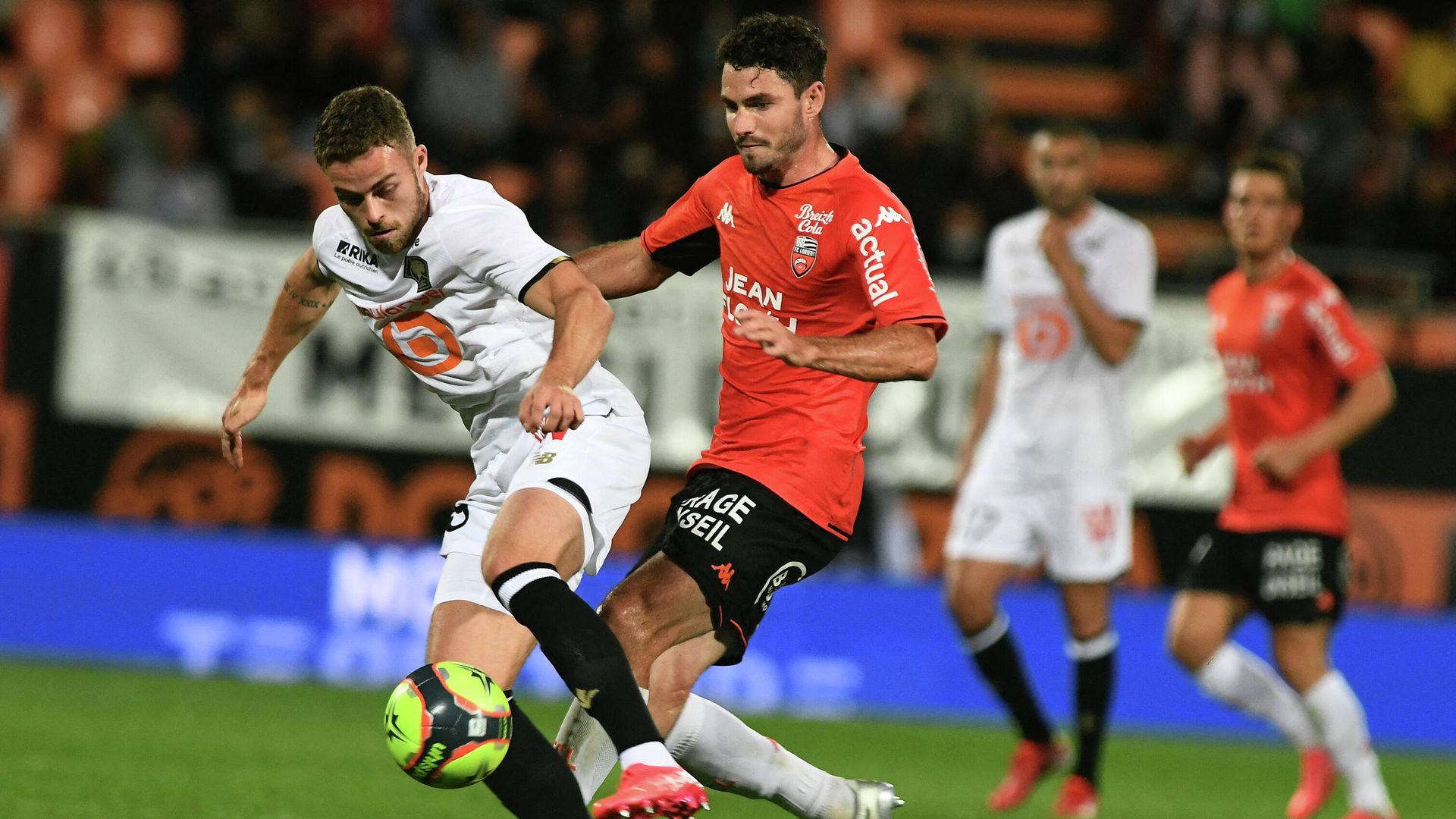 Lorient's French midfielder Thomas Monconduit (R) fights for the ball with Lille's defender Gabriel Johan Gudmundsson during the French L1 football match between FC Lorient and LOSC Lille, at the Moustoir stadium in Lorient, north-western France on September 10, 2021. (Photo by Fred TANNEAU / AFP) Lorient's French midfielder Thomas Monconduit (R) fights for the ball with Lille's defender Gabriel Johan Gudmundsson during the French L1 football match between FC Lorient and LOSC Lille, at the Moustoir stadium in Lorient, north-western France on September 10, 2021. (Photo by Fred TANNEAU / AFP) - РИА Новости, 1920, 11.09.2021