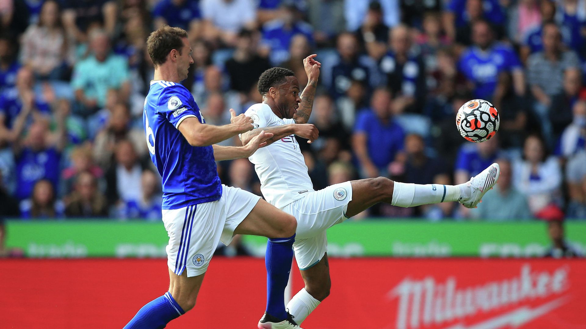 Leicester City's Northern Irish defender Jonny Evans (L) chases Manchester City's English midfielder Raheem Sterling during the English Premier League football match between Leicester City and Manchester City at King Power Stadium in Leicester, central England on September 11, 2021. (Photo by Lindsey Parnaby / AFP) / RESTRICTED TO EDITORIAL USE. No use with unauthorized audio, video, data, fixture lists, club/league logos or 'live' services. Online in-match use limited to 120 images. An additional 40 images may be used in extra time. No video emulation. Social media in-match use limited to 120 images. An additional 40 images may be used in extra time. No use in betting publications, games or single club/league/player publications. / Leicester City's Northern Irish defender Jonny Evans (L) chases Manchester City's English midfielder Raheem Sterling during the English Premier League football match between Leicester City and Manchester City at King Power Stadium in Leicester, central England on September 11, 2021. (Photo by Lindsey Parnaby / AFP) / RESTRICTED TO EDITORIAL USE. No use with unauthorized audio, video, data, fixture lists, club/league logos or 'live' services. Online in-match use limited to 120 images. An additional 40 images may be used in extra time. No video emulation. Social media in-match use limited to 120 images. An additional 40 images may be used in extra time. No use in betting publications, games or single club/league/player publications. / - РИА Новости, 1920, 11.09.2021