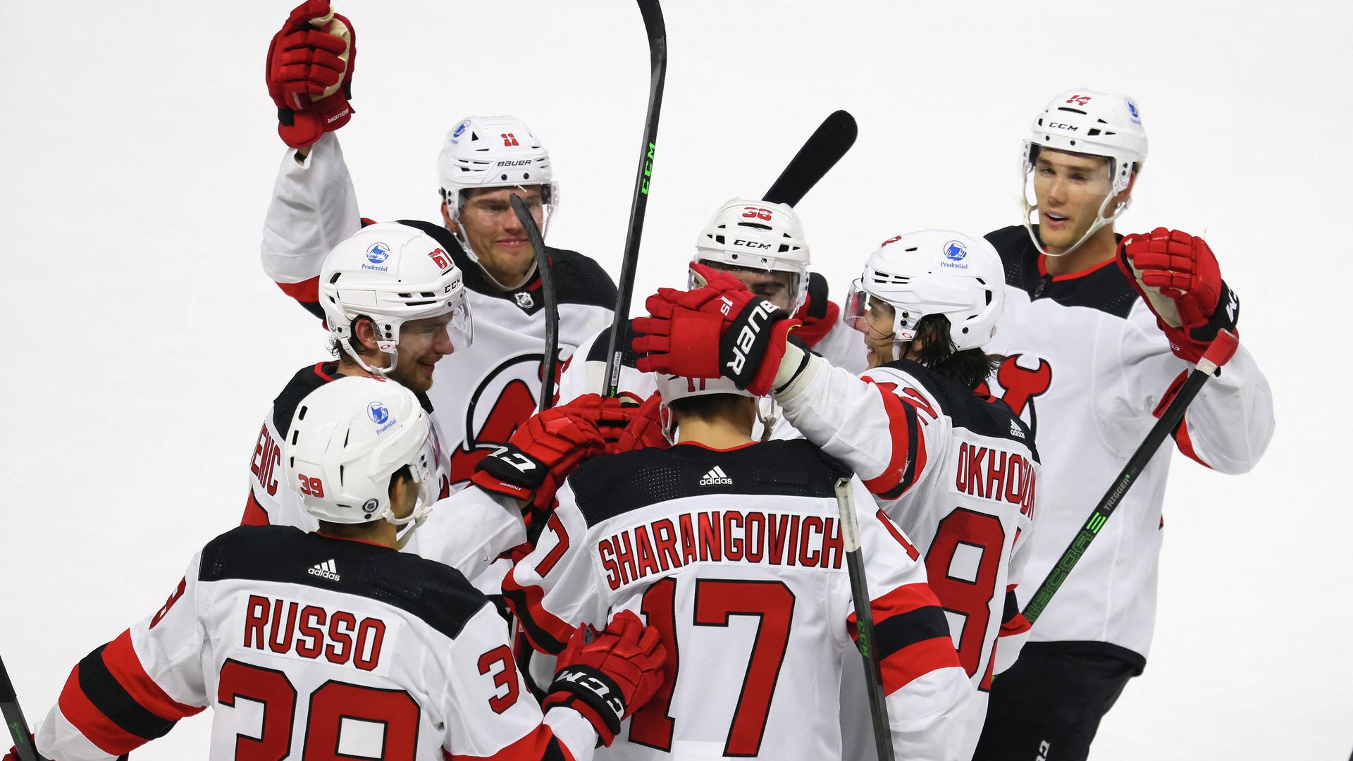BRIDGEPORT, CONNECTICUT - OCTOBER 02: Yegor Sharangovich #17 and the New Jersey Devils celebrate his game winning goal at 3:36 of overtime against the New York Islanders during a preseason game at the Webster Bank Arena at Harbor Yard on October 02, 2021 in Bridgeport, Connecticut. The Devils defeated the Islanders 2-1 in overtime. Bruce Bennett/Getty Images/AFP (Photo by BRUCE BENNETT / GETTY IMAGES NORTH AMERICA / Getty Images via AFP) BRIDGEPORT, CONNECTICUT - OCTOBER 02: Yegor Sharangovich #17 and the New Jersey Devils celebrate his game winning goal at 3:36 of overtime against the New York Islanders during a preseason game at the Webster Bank Arena at Harbor Yard on October 02, 2021 in Bridgeport, Connecticut. The Devils defeated the Islanders 2-1 in overtime. Bruce Bennett/Getty Images/AFP (Photo by BRUCE BENNETT / GETTY IMAGES NORTH AMERICA / Getty Images via AFP) - РИА Новости, 1920, 03.10.2021