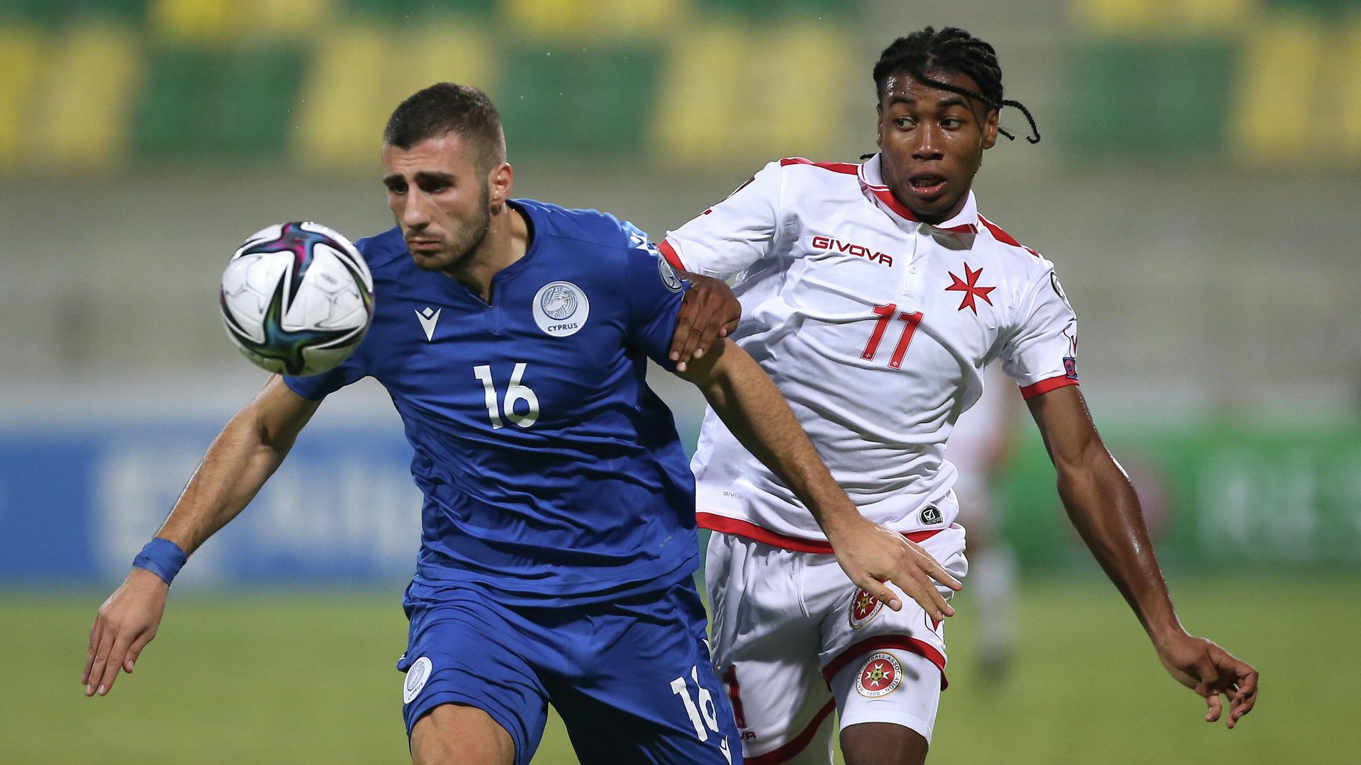 Soccer Football - World Cup - UEFA Qualifiers - Group H - Cyprus v Malta - AEK Arena - George Karapatakis, Larnaca, Cyprus - October 11, 2021 Cyprus' Costas Soteriou in action with Malta's Paul Mbong REUTERS/Yiannis Kourtoglou - РИА Новости, 1920, 11.10.2021