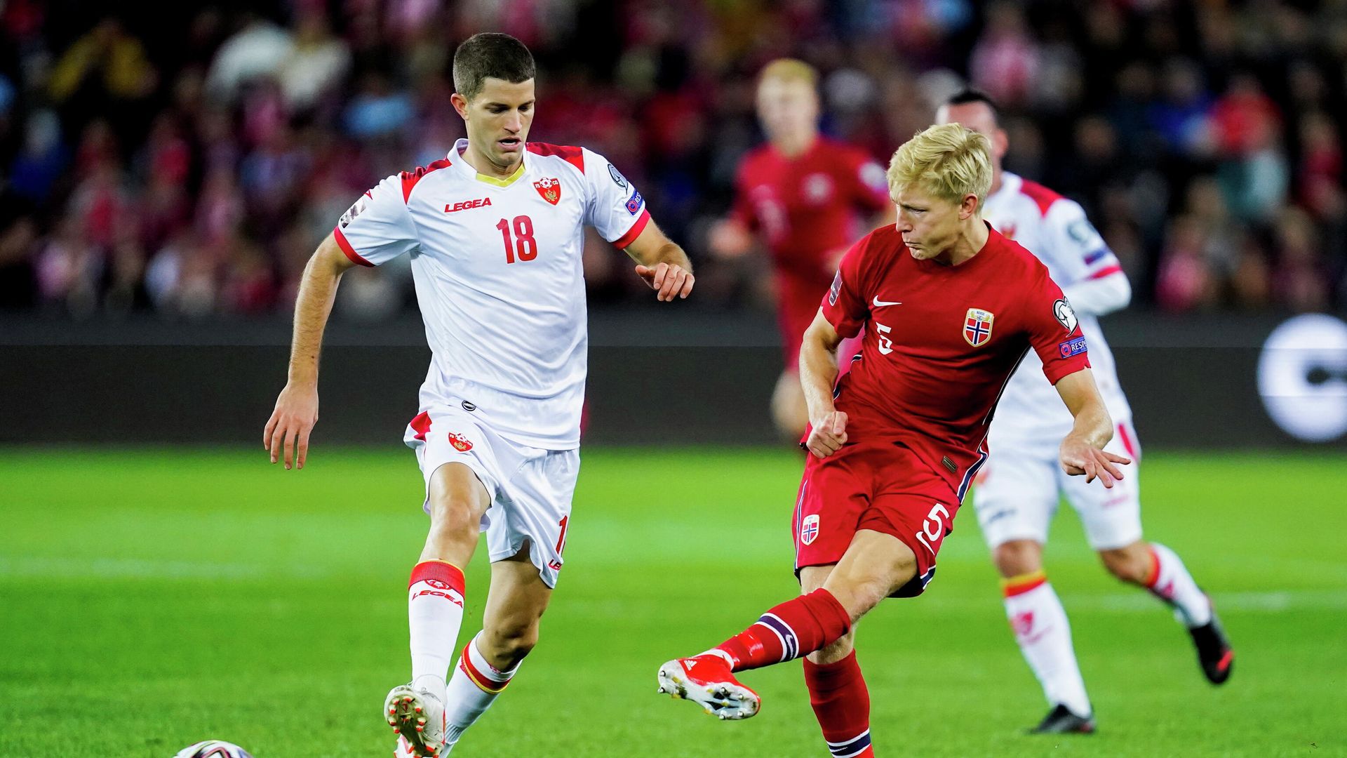 Soccer Football - World Cup - UEFA Qualifiers - Group G - Norway v Montenegro - Ullevaal Stadion, Oslo, Norway - October 11, 2021 Montenegro's Nebojsa Kosovic in action with Norway's Birger Meling Hakon Mosvold Larsen/NTB via REUTERS ATTENTION EDITORS - THIS IMAGE WAS PROVIDED BY A THIRD PARTY. NORWAY OUT. NO COMMERCIAL OR EDITORIAL SALES IN NORWAY. Soccer Football - World Cup - UEFA Qualifiers - Group G - Norway v Montenegro - Ullevaal Stadion, Oslo, Norway - October 11, 2021 Montenegro's Nebojsa Kosovic in action with Norway's Birger Meling Hakon Mosvold Larsen/NTB via REUTERS ATTENTION EDITORS - THIS IMAGE WAS PROVIDED BY A THIRD PARTY. NORWAY OUT. NO COMMERCIAL OR EDITORIAL SALES IN NORWAY. - РИА Новости, 1920, 12.10.2021