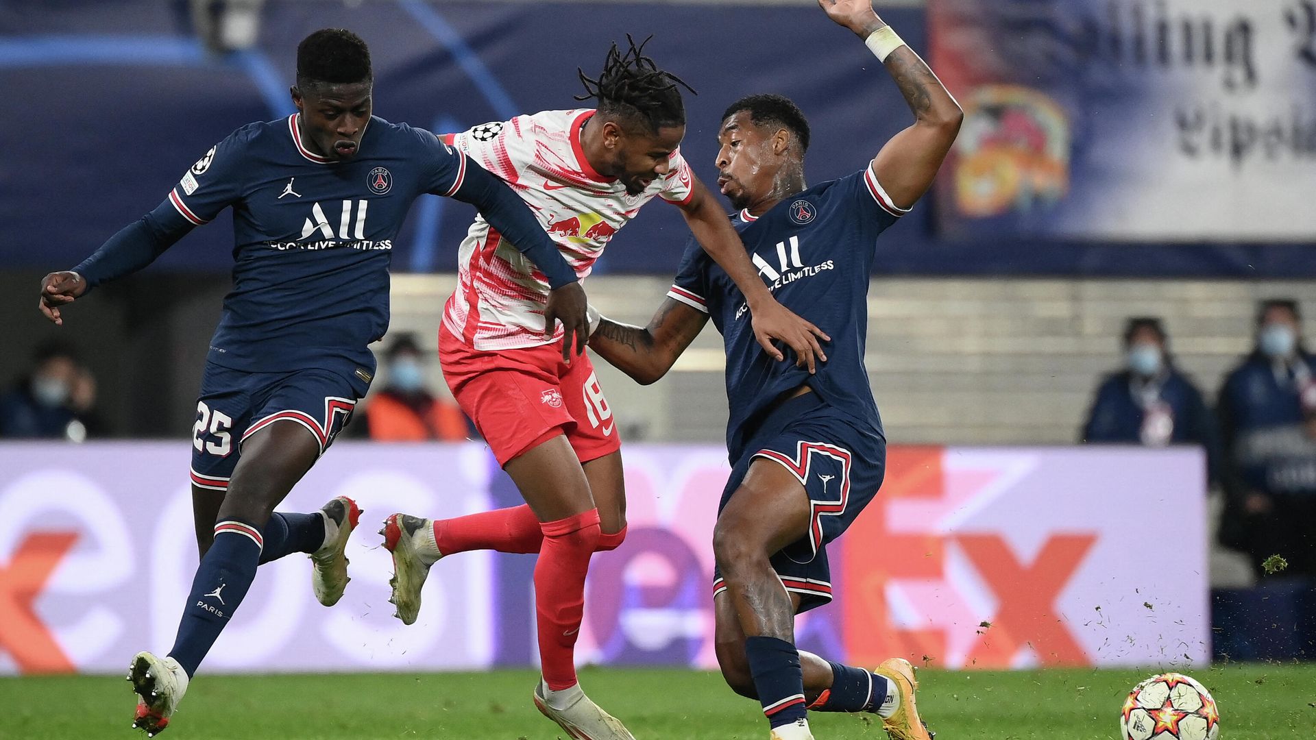 (L-R) Paris Saint-Germain's Portuguese defender Nuno Mendes, Leipzig's French midfielder Christopher Nkunku and Paris Saint-Germain's French defender Presnel Kimpembe vie for the ball during the UEFA Champions League, Group A, football match RB Leipzig v Paris Saint-Germain in Leipzig, eastern Germany on November 3, 2021. (Photo by FRANCK FIFE / AFP) - РИА Новости, 1920, 04.11.2021