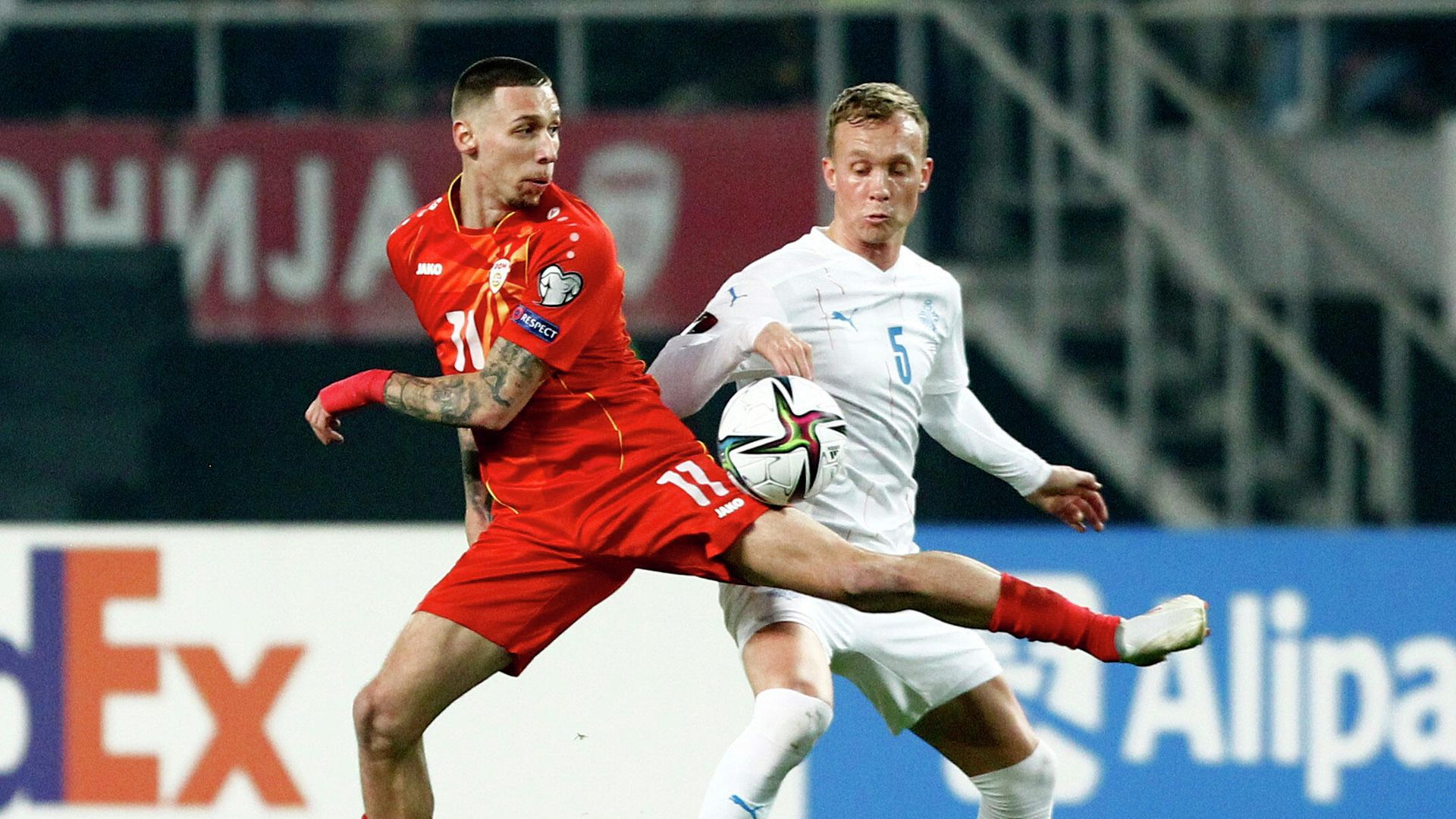 Soccer Football - World Cup - UEFA Qualifiers - Group J - North Macedonia v Iceland - Toshe Proeski Arena, Skopje, North Macedonia - November 14, 2021 North Macedonia's Darko Churlinov in action with Iceland's Gudmundur Thorarinsson REUTERS/Ognen Teofilovski Soccer Football - World Cup - UEFA Qualifiers - Group J - North Macedonia v Iceland - Toshe Proeski Arena, Skopje, North Macedonia - November 14, 2021 North Macedonia's Darko Churlinov in action with Iceland's Gudmundur Thorarinsson REUTERS/Ognen Teofilovski - РИА Новости, 1920, 14.11.2021