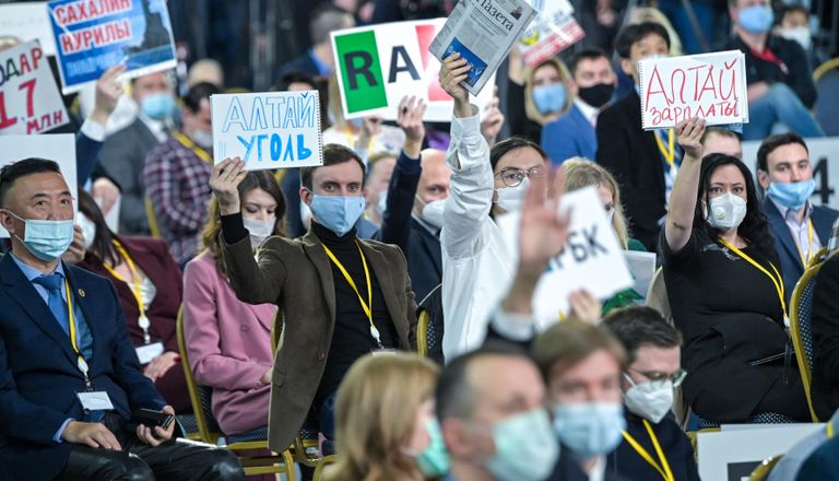 Журналисты во время большой ежегодной пресс-конференции президента РФ Владимира Путина в Центральном выставочном зале Манеж Журналисты во время большой ежегодной пресс-конференции президента РФ Владимира Путина в Центральном выставочном зале Манеж