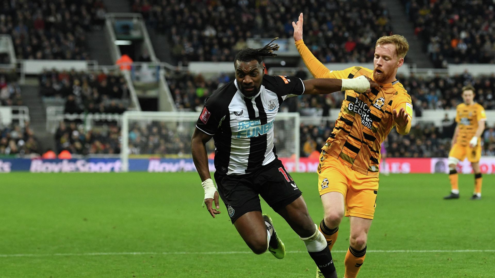 Newcastle United's French midfielder Allan Saint-Maximin (L) vies with Cambridge United's English midfielder James Brophy (R) during the English FA Cup third round football match between Newcastle United and Cambridge United at St James' Park in Newcastle-upon-Tyne, north east England on January 8, 2022. (Photo by Paul ELLIS / AFP) / RESTRICTED TO EDITORIAL USE. No use with unauthorized audio, video, data, fixture lists, club/league logos or 'live' services. Online in-match use limited to 120 images. An additional 40 images may be used in extra time. No video emulation. Social media in-match use limited to 120 images. An additional 40 images may be used in extra time. No use in betting publications, games or single club/league/player publications. / Newcastle United's French midfielder Allan Saint-Maximin (L) vies with Cambridge United's English midfielder James Brophy (R) during the English FA Cup third round football match between Newcastle United and Cambridge United at St James' Park in Newcastle-upon-Tyne, north east England on January 8, 2022. (Photo by Paul ELLIS / AFP) / RESTRICTED TO EDITORIAL USE. No use with unauthorized audio, video, data, fixture lists, club/league logos or 'live' services. Online in-match use limited to 120 images. An additional 40 images may be used in extra time. No video emulation. Social media in-match use limited to 120 images. An additional 40 images may be used in extra time. No use in betting publications, games or single club/league/player publications. / - РИА Новости, 1920, 08.01.2022