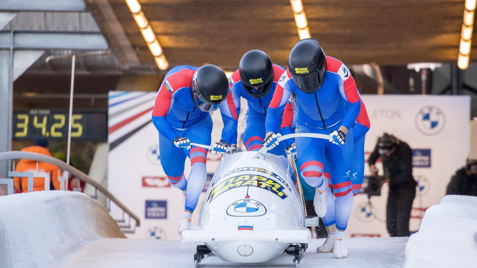 Russia's Maxim Andrianov, Aleksei Pushkarev, Vasiliy Kondratenko and Egor Gryaznov start for the first run of the four-man bobsleigh competition during the IBSF Bob and Skeleton World Cup, the opening event of the Olympic season, at the Olympic sliding track in Innsbruck, Austria, on November 21, 2021. (Photo by Johann GRODER / various sources / AFP) / Austria OUT Russia's Maxim Andrianov, Aleksei Pushkarev, Vasiliy Kondratenko and Egor Gryaznov start for the first run of the four-man bobsleigh competition during the IBSF Bob and Skeleton World Cup, the opening event of the Olympic season, at the Olympic sliding track in Innsbruck, Austria, on November 21, 2021. (Photo by Johann GRODER / various sources / AFP) / Austria OUT - РИА Новости, 1920, 09.01.2022