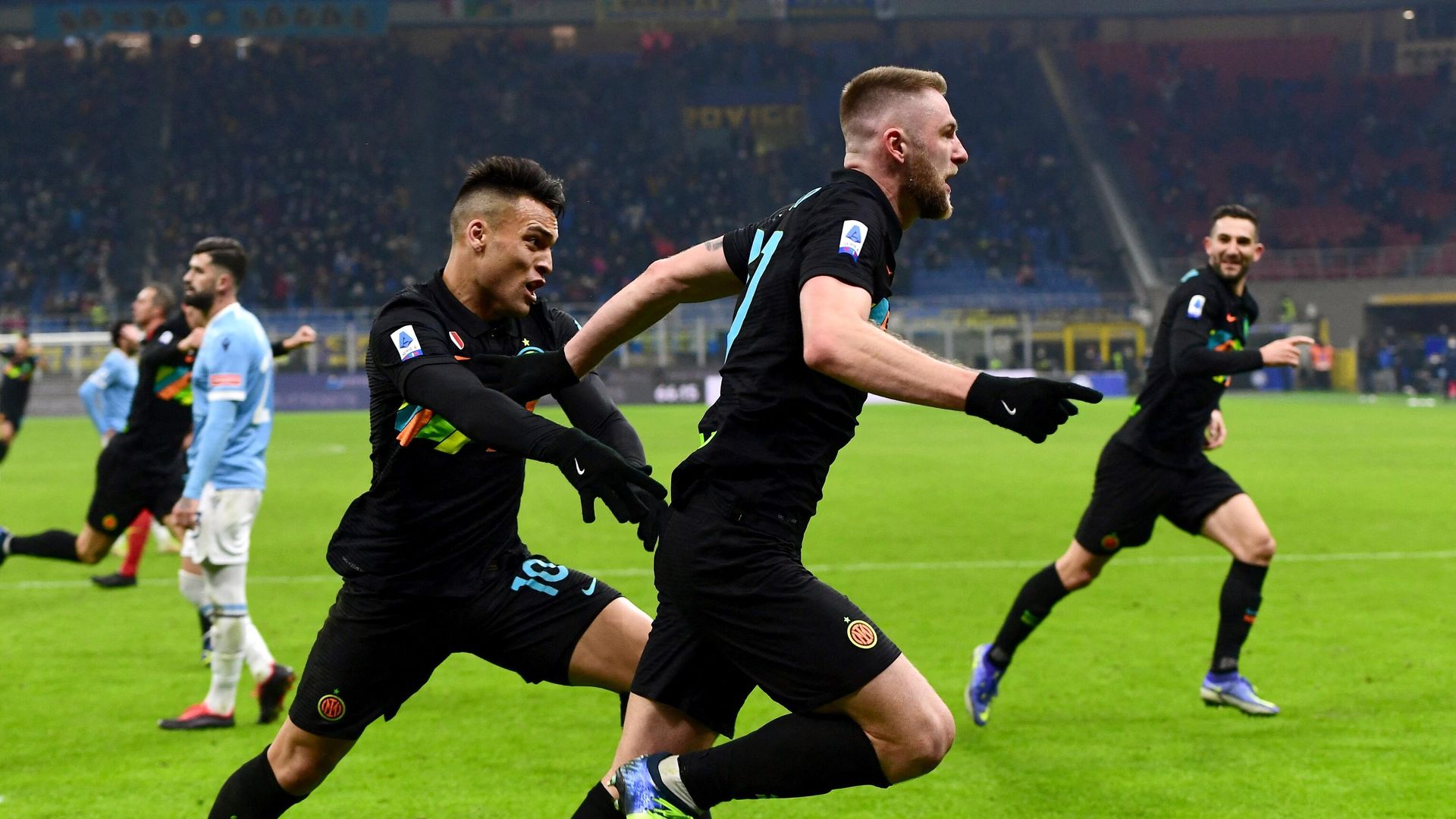Inter Milan's Slovakian defender Milan Skriniar (C) celebrates with Inter Milan's Argentine forward Lautaro Martinez (L) after scoring a goal during the Serie A football match beetween Inter Milan and Lazio at the Meazza stadium in Milan on January 9, 2022. (Photo by Miguel MEDINA / AFP) Inter Milan's Slovakian defender Milan Skriniar (C) celebrates with Inter Milan's Argentine forward Lautaro Martinez (L) after scoring a goal during the Serie A football match beetween Inter Milan and Lazio at the Meazza stadium in Milan on January 9, 2022. (Photo by Miguel MEDINA / AFP) - РИА Новости, 1920, 10.01.2022