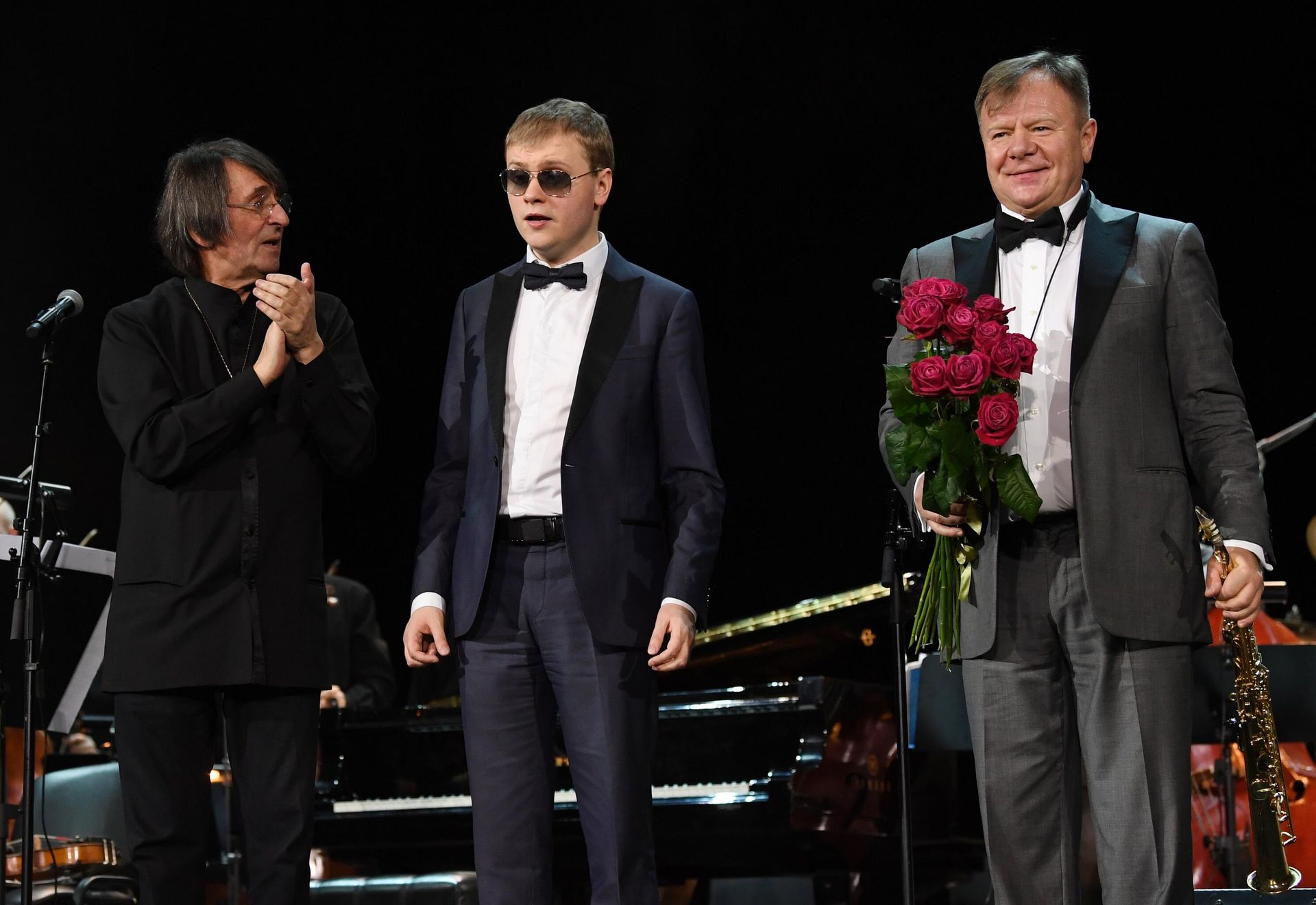 Музыканты Юрий Башмет, Олег Аккуратов и Игорь Бутман (слева направо) во время выступления на совместном концерте Симфонического оркестра Юрия Башмета и Московского джазового оркестра Игоря Бутмана в рамках XV Зимнего международного фестиваля искусств в Сочи. Музыканты Юрий Башмет, Олег Аккуратов и Игорь Бутман (слева направо) во время выступления на совместном концерте Симфонического оркестра Юрия Башмета и Московского джазового оркестра Игоря Бутмана в рамках XV Зимнего международного фестиваля искусств в Сочи. - РИА Новости, 1920, 21.02.2022