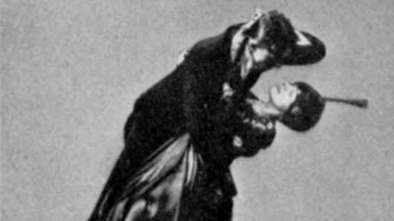 Иллюстрация из книги 1914 года о танцах, на которой пара демонстрирует танцевальное движение танго