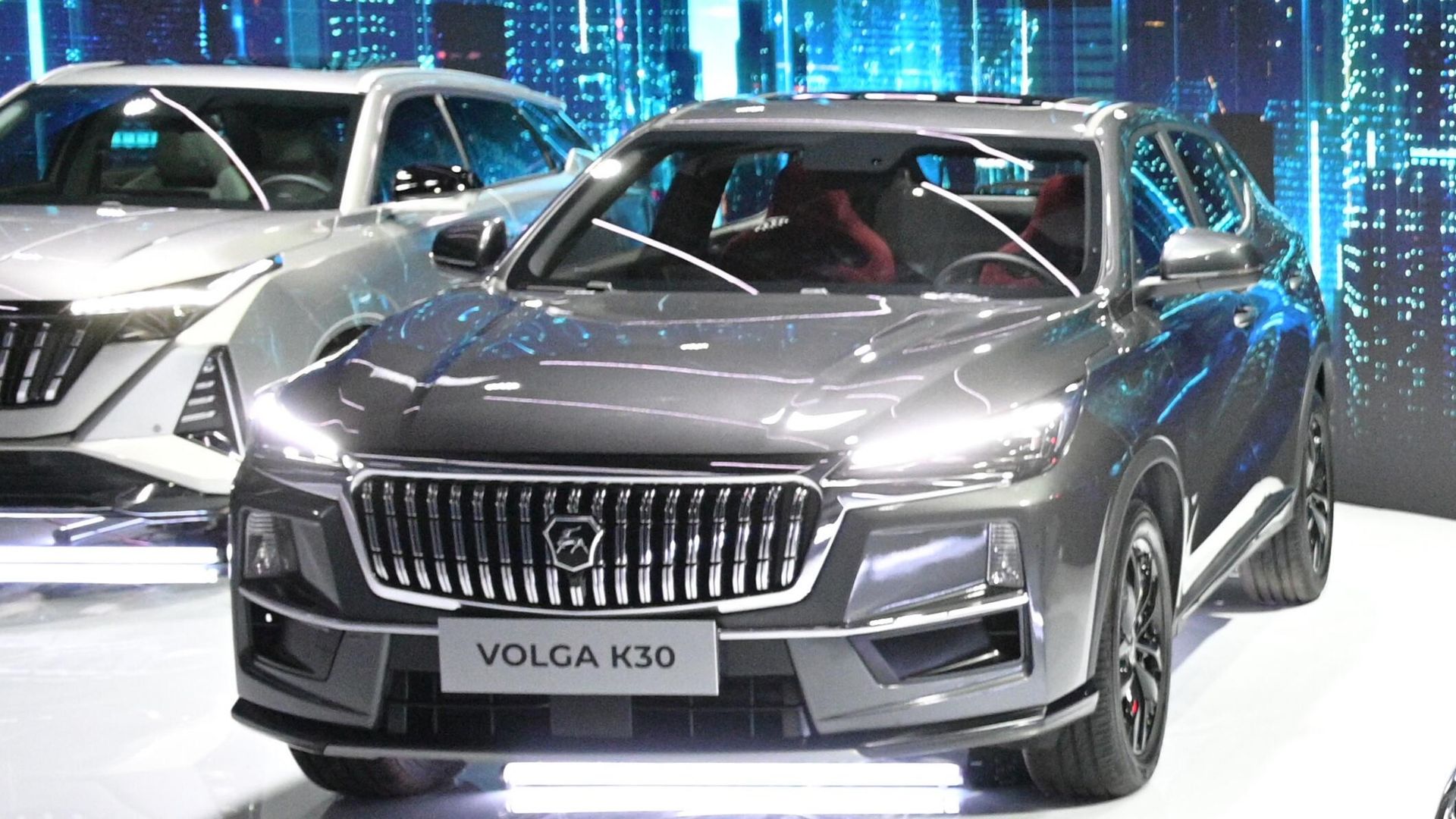 Новый автомобиль Volga К30 в павильоне марки VOLGA на выставке IX конференции Цифровая индустрия промышленной России в Нижнем Новгороде Новый автомобиль Volga К30 в павильоне марки VOLGA на выставке IX конференции Цифровая индустрия промышленной России в Нижнем Новгороде - РИА Новости, 1920, 22.05.2024