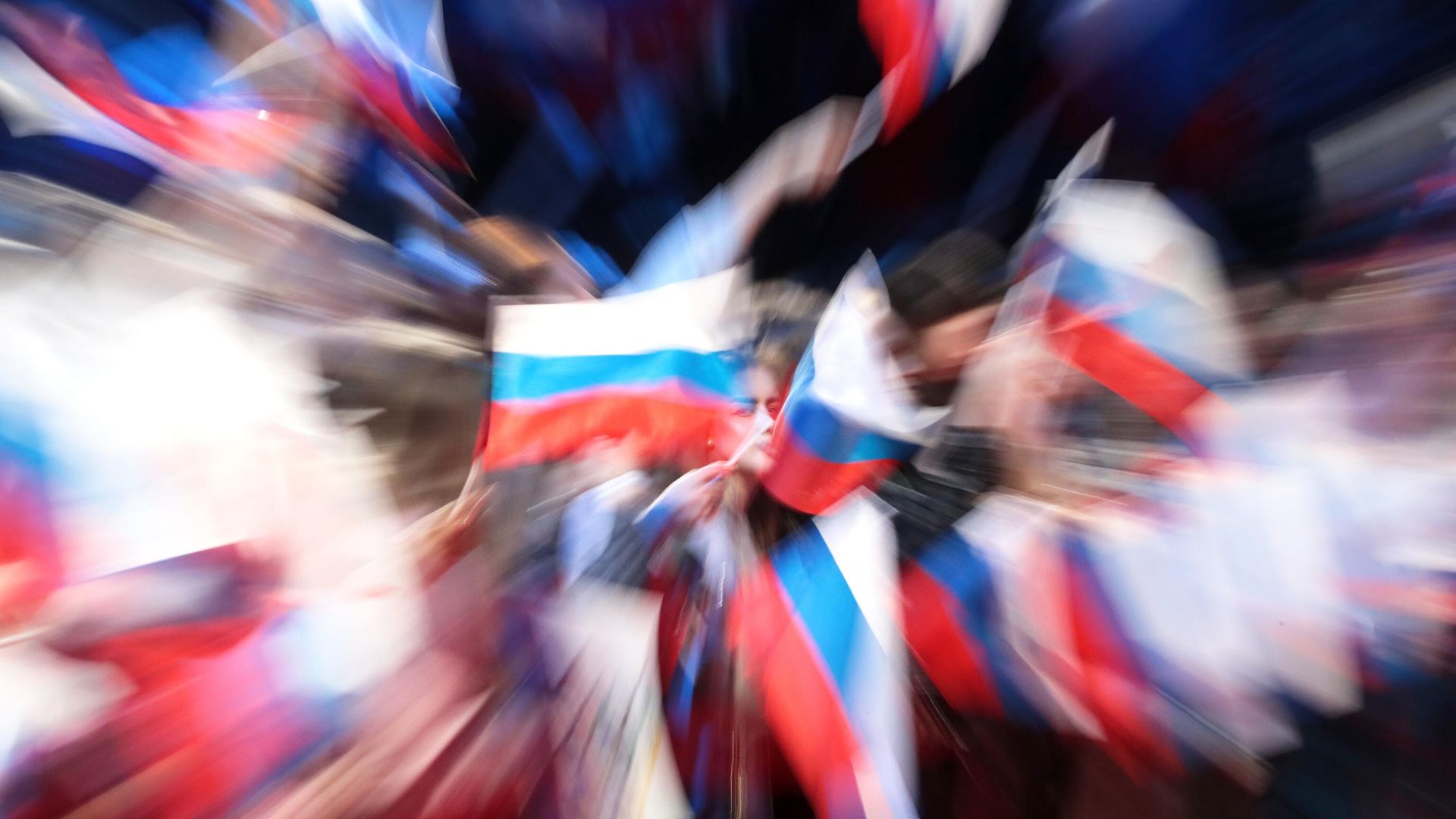 Флаги на концерте в честь торжественной встречи олимпийцев - РИА Новости, 1920, 22.03.2025