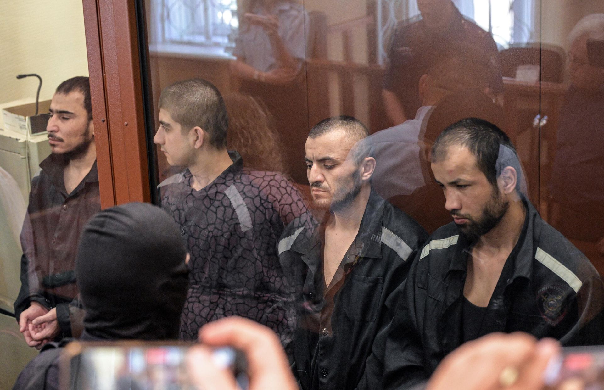 Фигуранты по делу о теракте в Крокус Сити Холле Далерджон Мирзоев, Муродали Рачабализоде, Мухаммадсобир Файзов и Шамсидин Фаридуни на заседании Басманного суда Москвы - РИА Новости, 1920, 11.03.2026