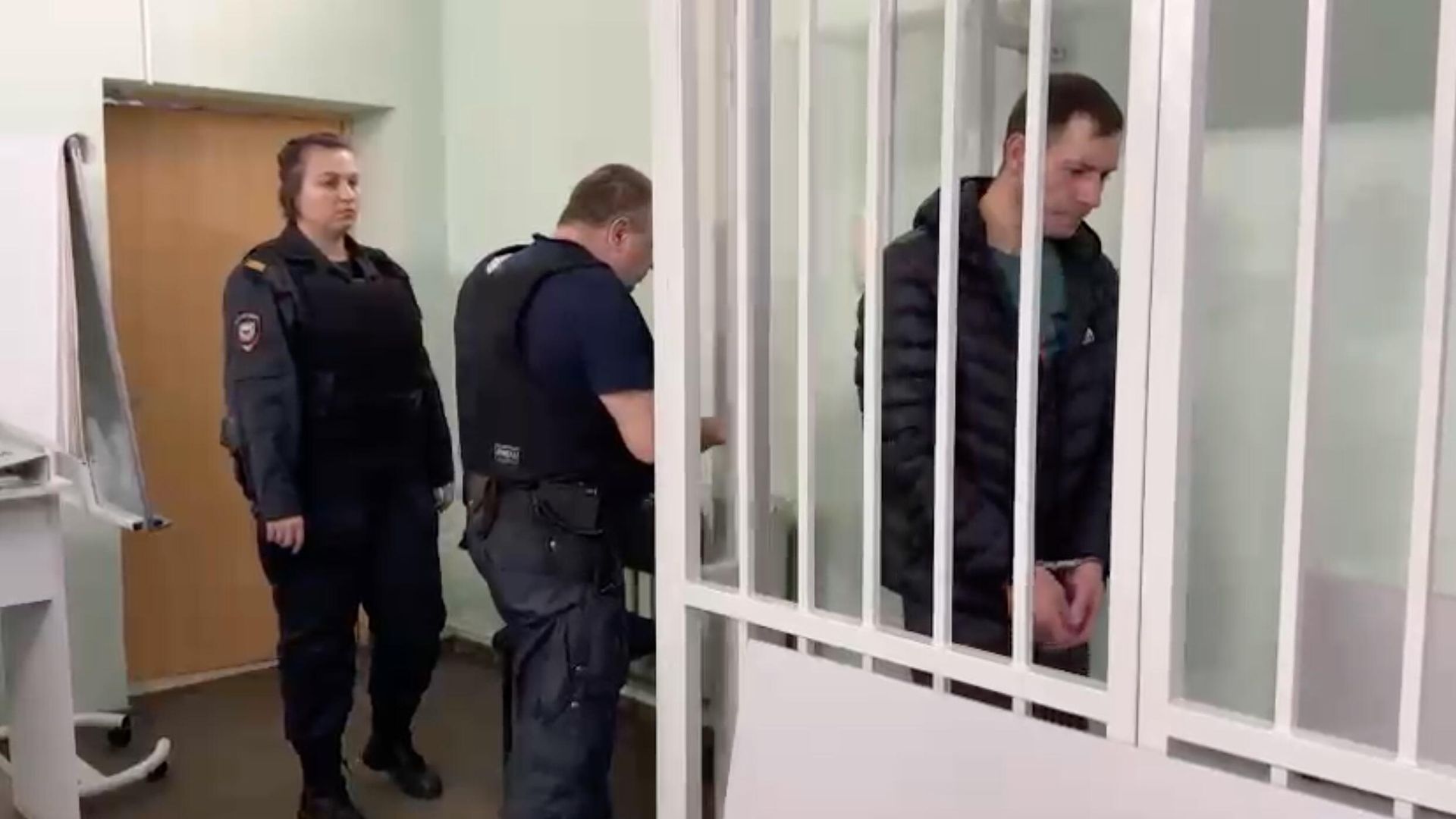 Иностранный гражданин, обвиняемый в убийстве бывшей супруги и покушении на убийство ее знакомого, в суде. Кадр видео Иностранный гражданин, обвиняемый в убийстве бывшей супруги и покушении на убийство ее знакомого, в суде. Кадр видео - РИА Новости, 1920, 10.01.2025