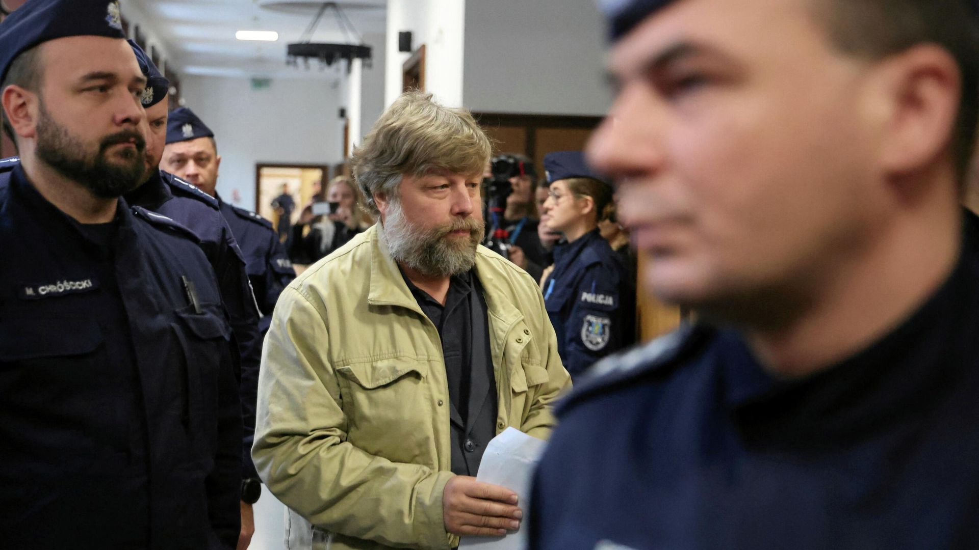 Российский археолог Александр Бутягин в районном суде Варшавы - РИА Новости, 1920, 18.03.2026