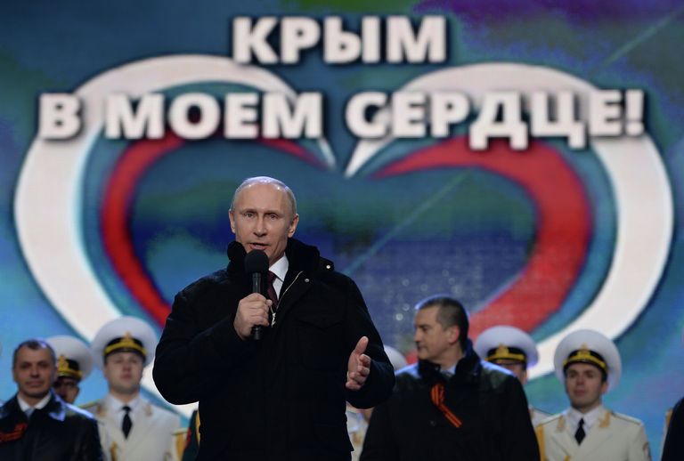 Президент России Владимир Путин во время выступления на митинг-концерте на Красной площади в Москве. 18 марта 2014 