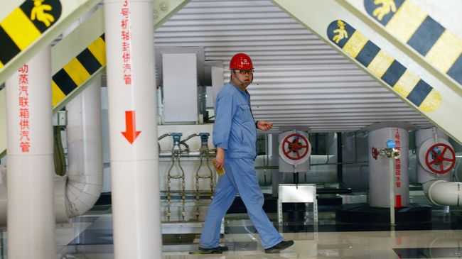 Работник газовой электростанции Пекина, Китай Работник газовой электростанции Пекина, Китай