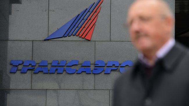 Логотип авиакомпании Трансаэро на здании в Москве. Архивное фото Логотип авиакомпании Трансаэро на здании в Москве. Архивное фото