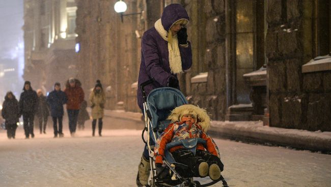 Снегопад в Москве. Архивное фото Снегопад в Москве. Архивное фото
