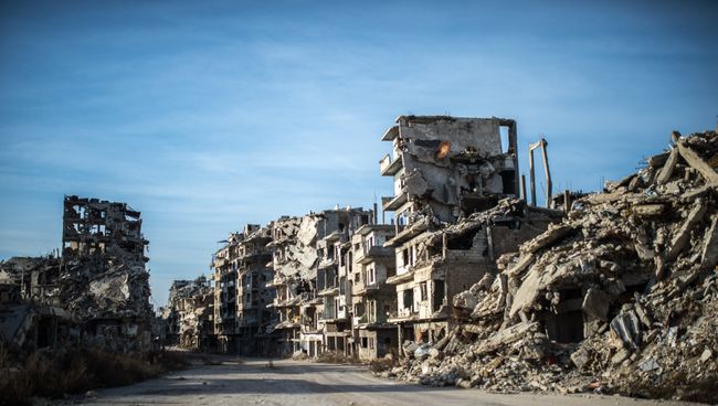 Разрушенные здания в районе Старого города в Хомсе. Архивное фото Разрушенные здания в районе Старого города в Хомсе. Архивное фото