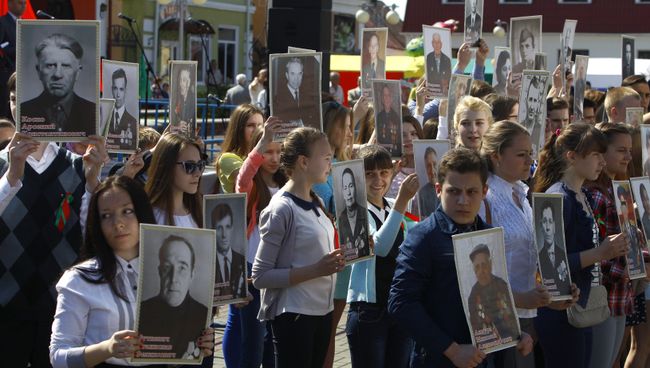 Акция Бессмертный полк в Белоруссии. Архивное фото Акция Бессмертный полк в Белоруссии. Архивное фото