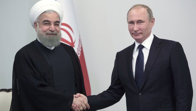 Президент России Владимир Путин и президент Исламской Республики Иран Хасан Роухани. Архивное фото Президент России Владимир Путин и президент Исламской Республики Иран Хасан Роухани. Архивное фото