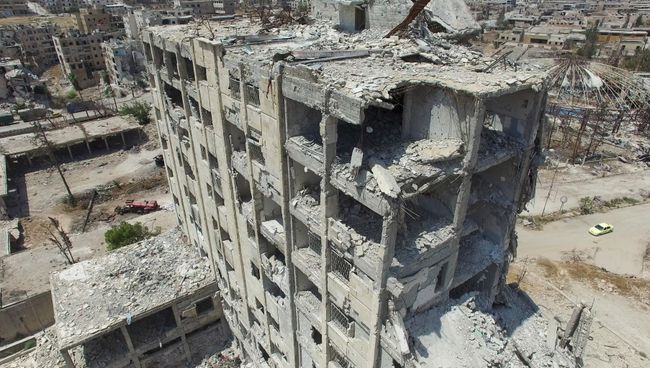 Разрушенное здание в квартале Бани-Зейд на севере Алеппо Разрушенное здание в квартале Бани-Зейд на севере Алеппо