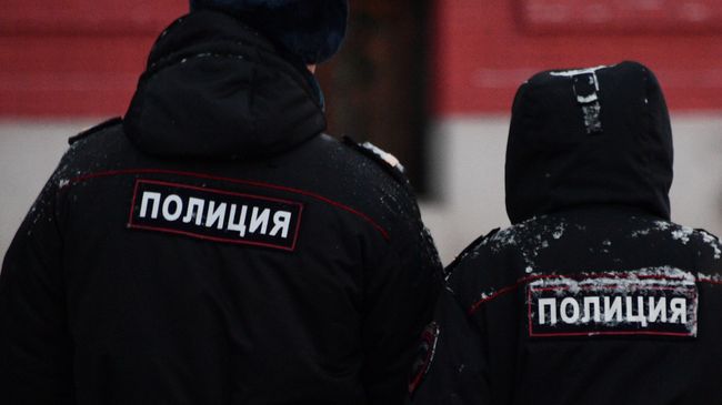 Сотрудники полиции на улице Москвы. Архивное фото Сотрудники полиции на улице Москвы. Архивное фото