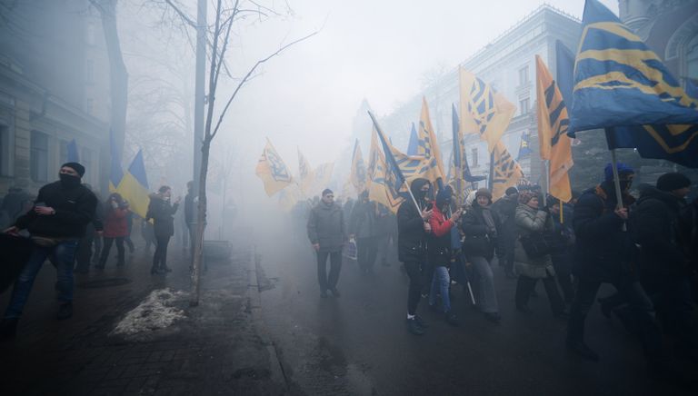 Представители националистических организаций во время шествия в центре Киева Представители националистических организаций во время шествия в центре Киева