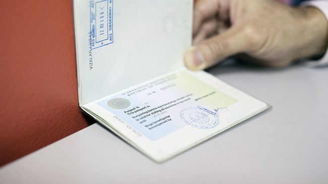 Выездная виза в паспорте гражданина Узбекистана. Архивное фото Выездная виза в паспорте гражданина Узбекистана. Архивное фото
