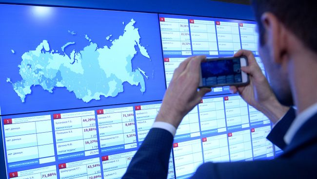 Информационные экраны в Центральной избирательной комиссии в единый день голосования. Архивное фото Информационные экраны в Центральной избирательной комиссии в единый день голосования. Архивное фото