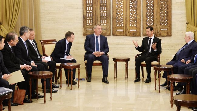 Вице-премьер РФ Дмитрий Рогозин и президент Сирийской Арабской Республики Башар Асад на встрече в Сирийской Арабской Республике. 18 декабря 2017 Вице-премьер РФ Дмитрий Рогозин и президент Сирийской Арабской Республики Башар Асад на встрече в Сирийской Арабской Республике. 18 декабря 2017